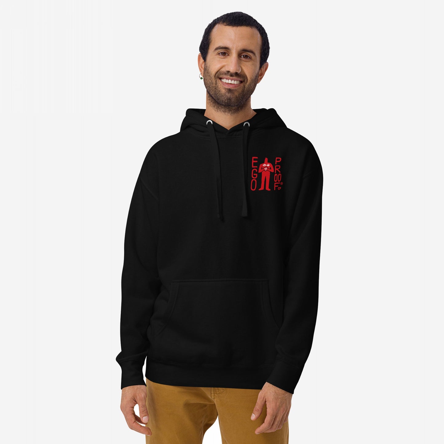 99 Problems Hoodie EU worn by smiling man, features “EGO PROOF” graphic on chest, back print reads “I Got 99 Problems. And Also, Anxiety.” Casual, comfortable fit.