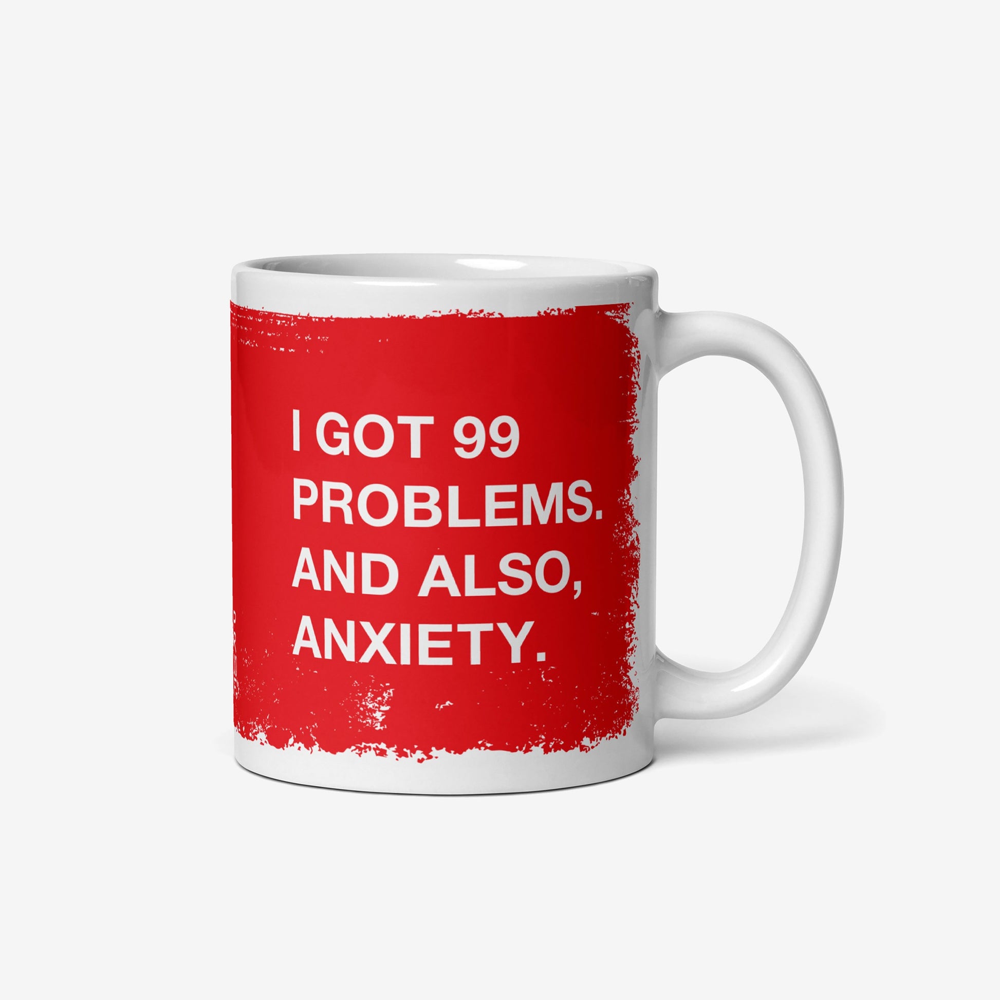 White ceramic mug with red text "I got 99 problems. And also, anxiety." on both sides, called 99 Problems Mug.