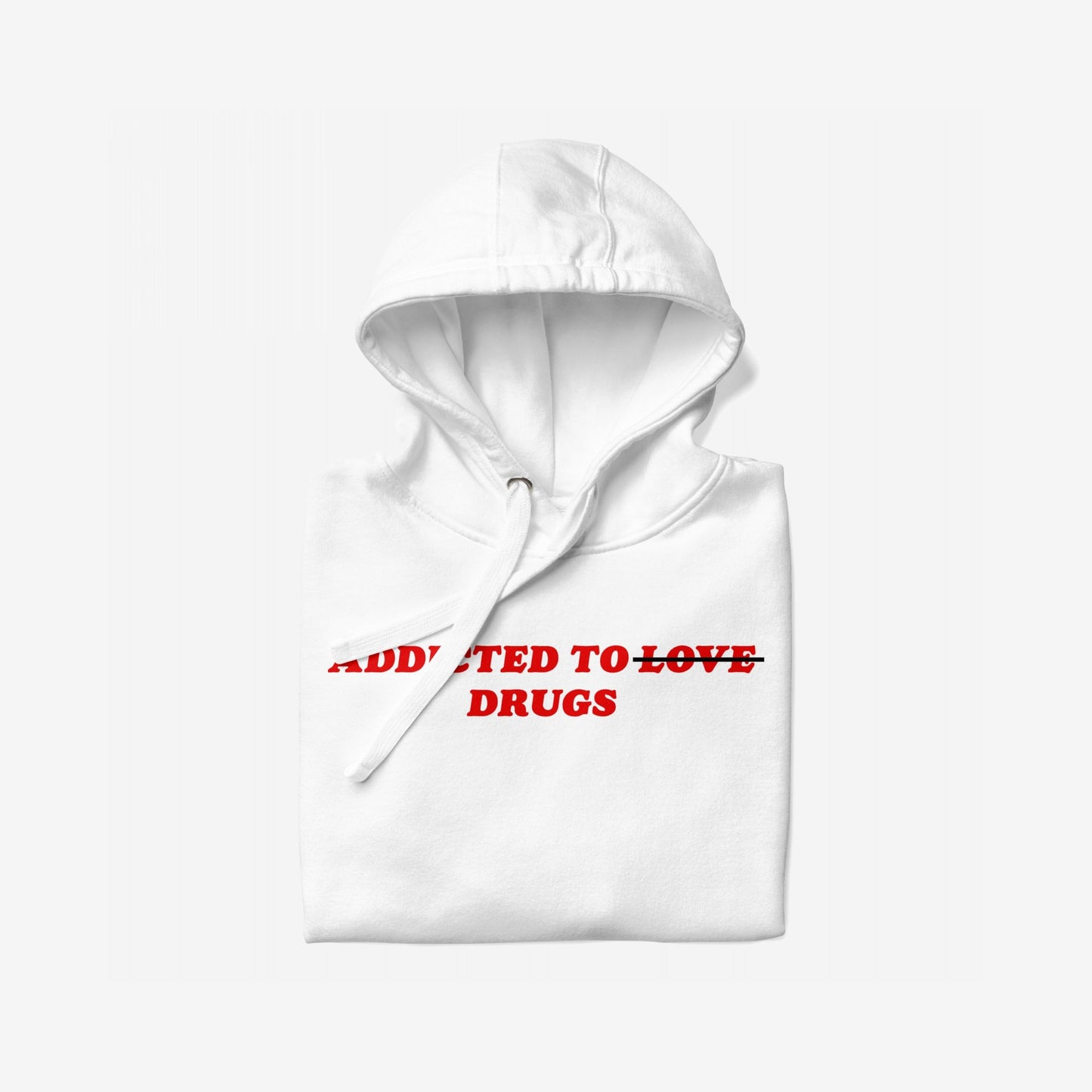 Folded white hoodie titled Addicted To Love / Drugs Hoodie EU features bold red text, ADDICTED TO LOVE, with TO LOVE crossed out and DRUGS beneath. Ideal for self-care or gifting.