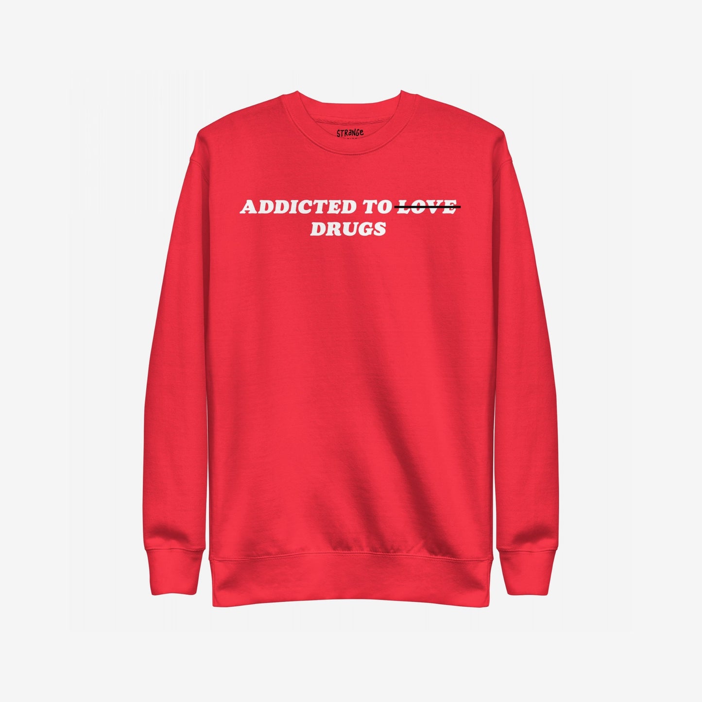 Addicted To Love / Drugs Sweatshirt EU: A red crewneck with bold text humorously altering Addicted to Love to Drugs, embodying candid mental health expression. Features a subtle label at the back neckline.