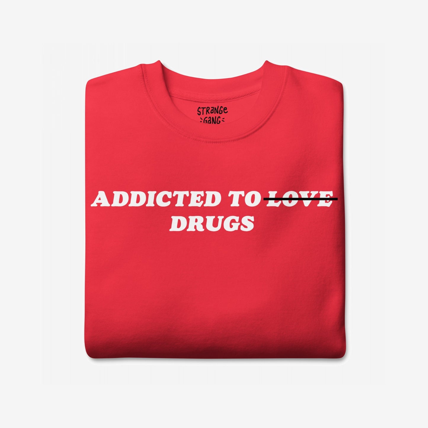 Addicted To Love / Drugs Sweatshirt EU featuring a red crew-neck with crossed-out LOVE and DRUGS below. This unisex piece combines dark humor and honesty, ideal for self-expression and mental health awareness.