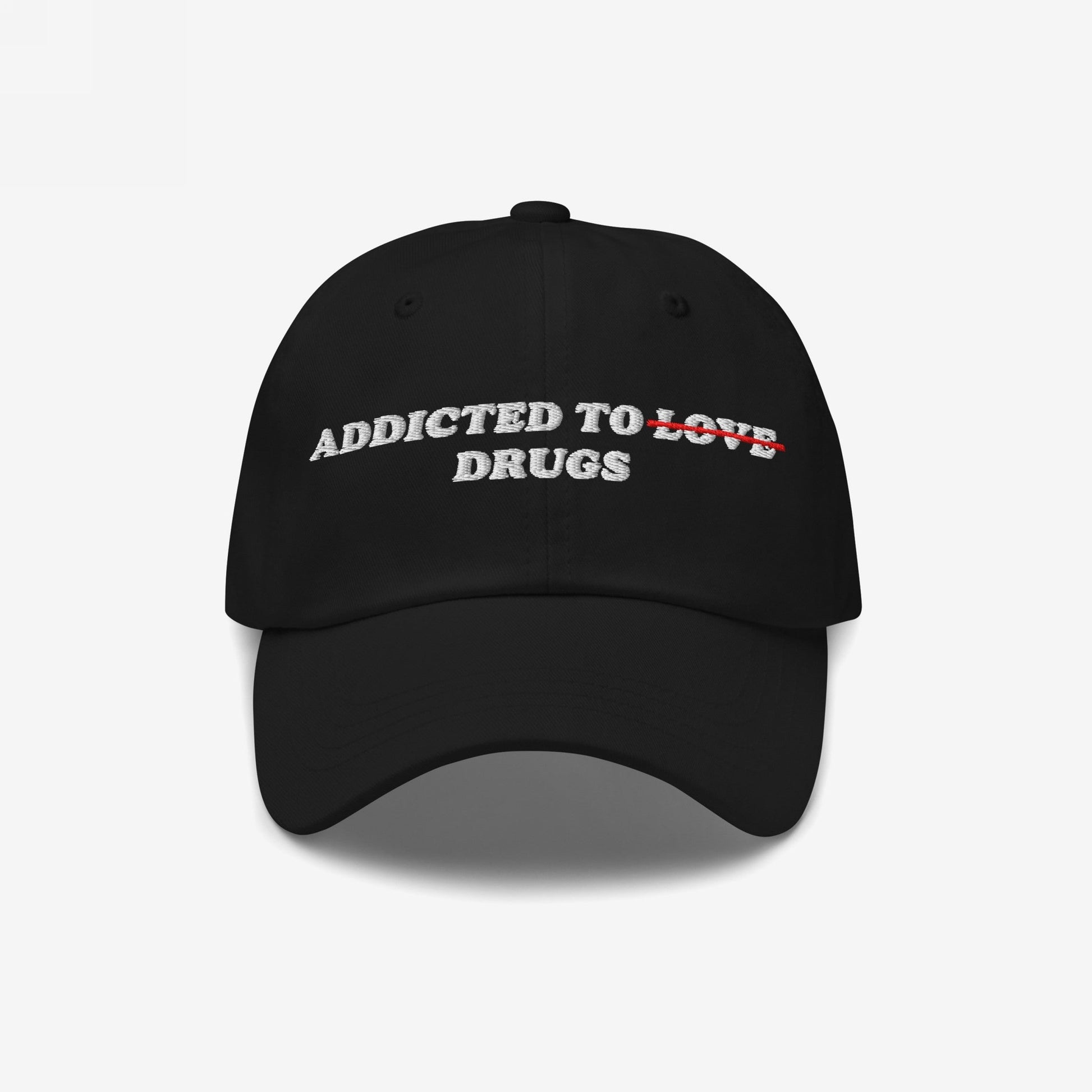 The Egoproof Addicted To Love / Drugs Hat is a black embroidered snapback featuring white ADDICTED TO DRUGS text with LOVE crossed out in red, making a bold mental health statement.