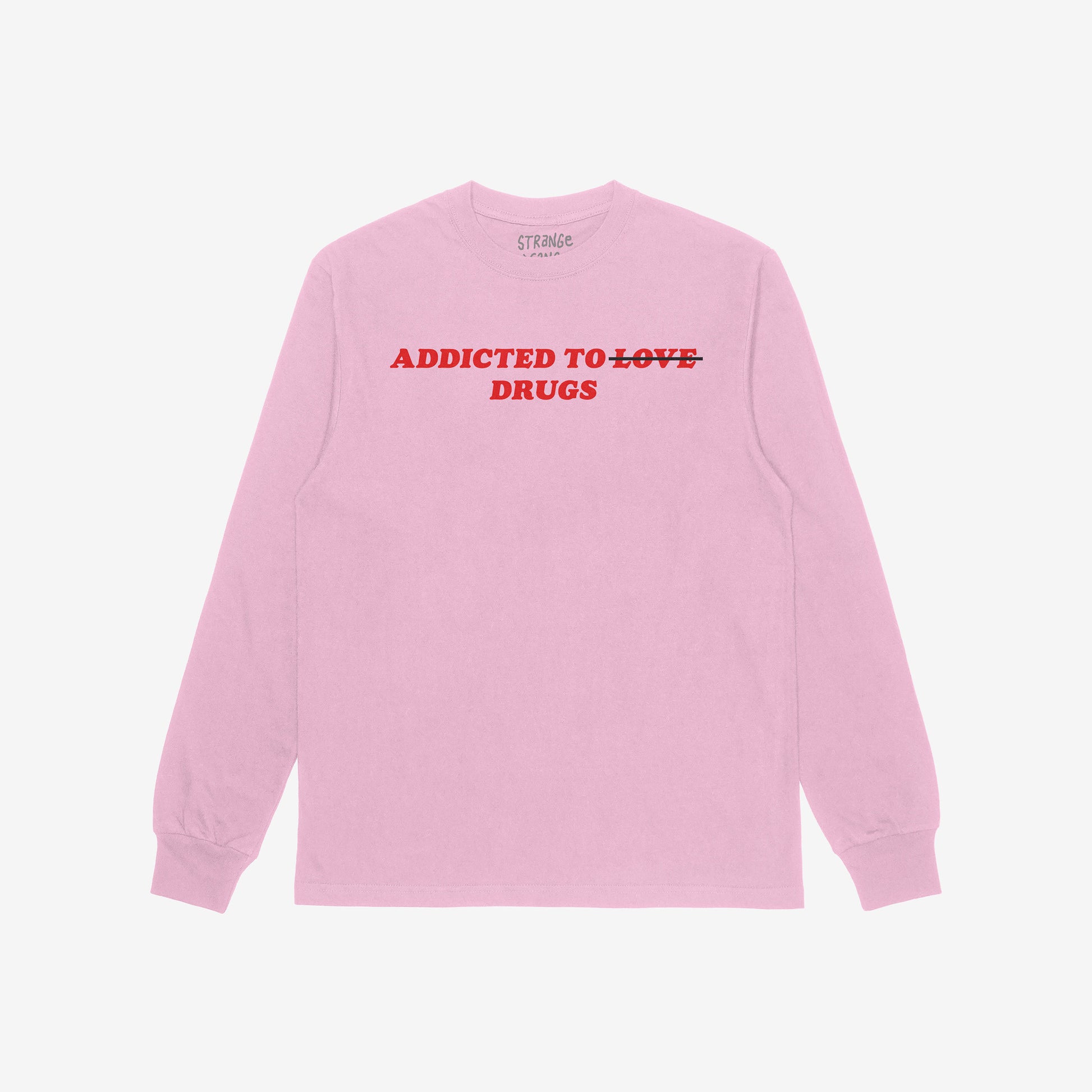 Addicted To Love / Drugs Long Sleeve T-shirt in pink with bold red text crossing out love and highlighting drugs on front.