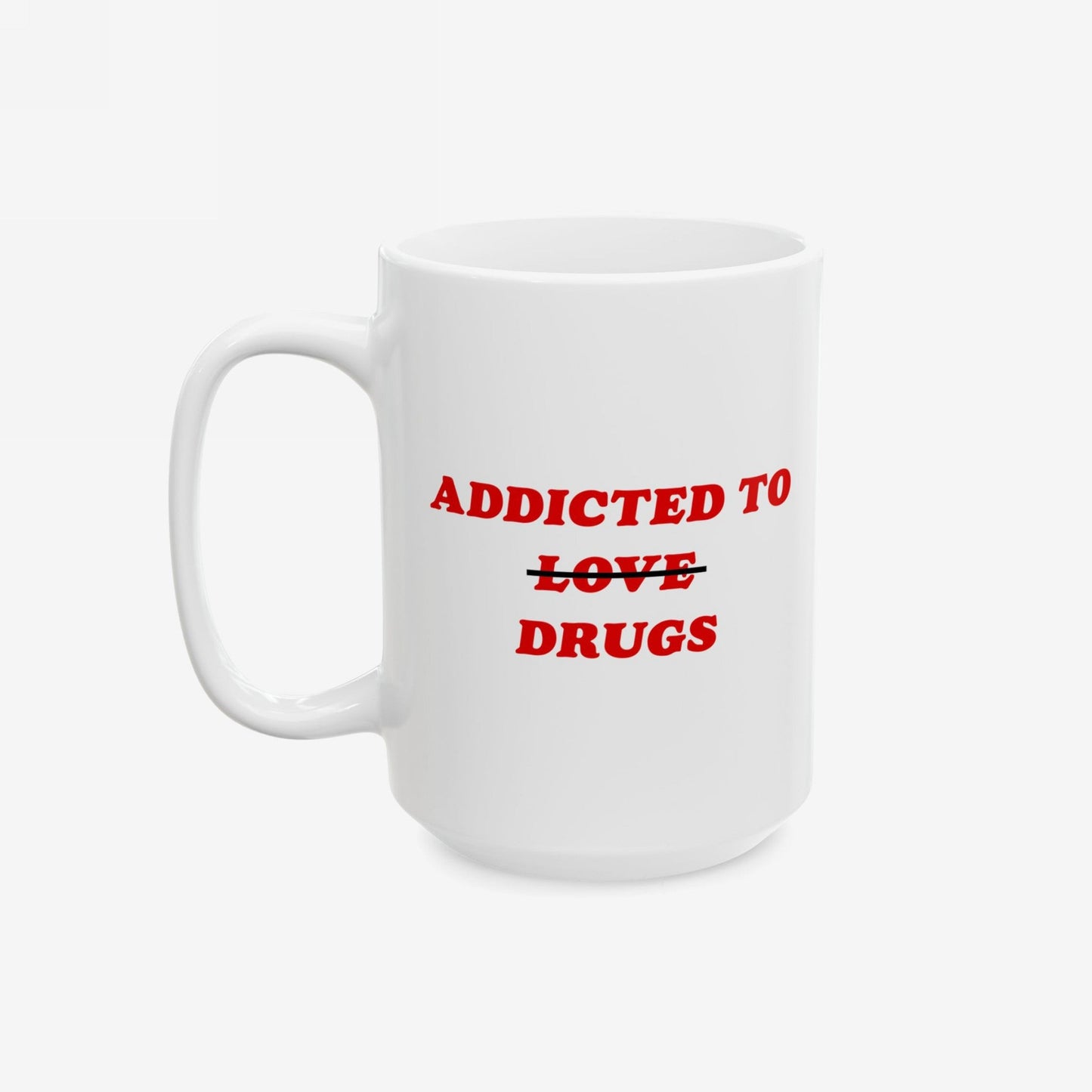 Plain white ceramic mug with bold red text: ADDICTED TO ~~LOVE~~ DRUGS. The word LOVE is crossed out, replaced by DRUGS. Perfect for a humorous take on mental health themes.
