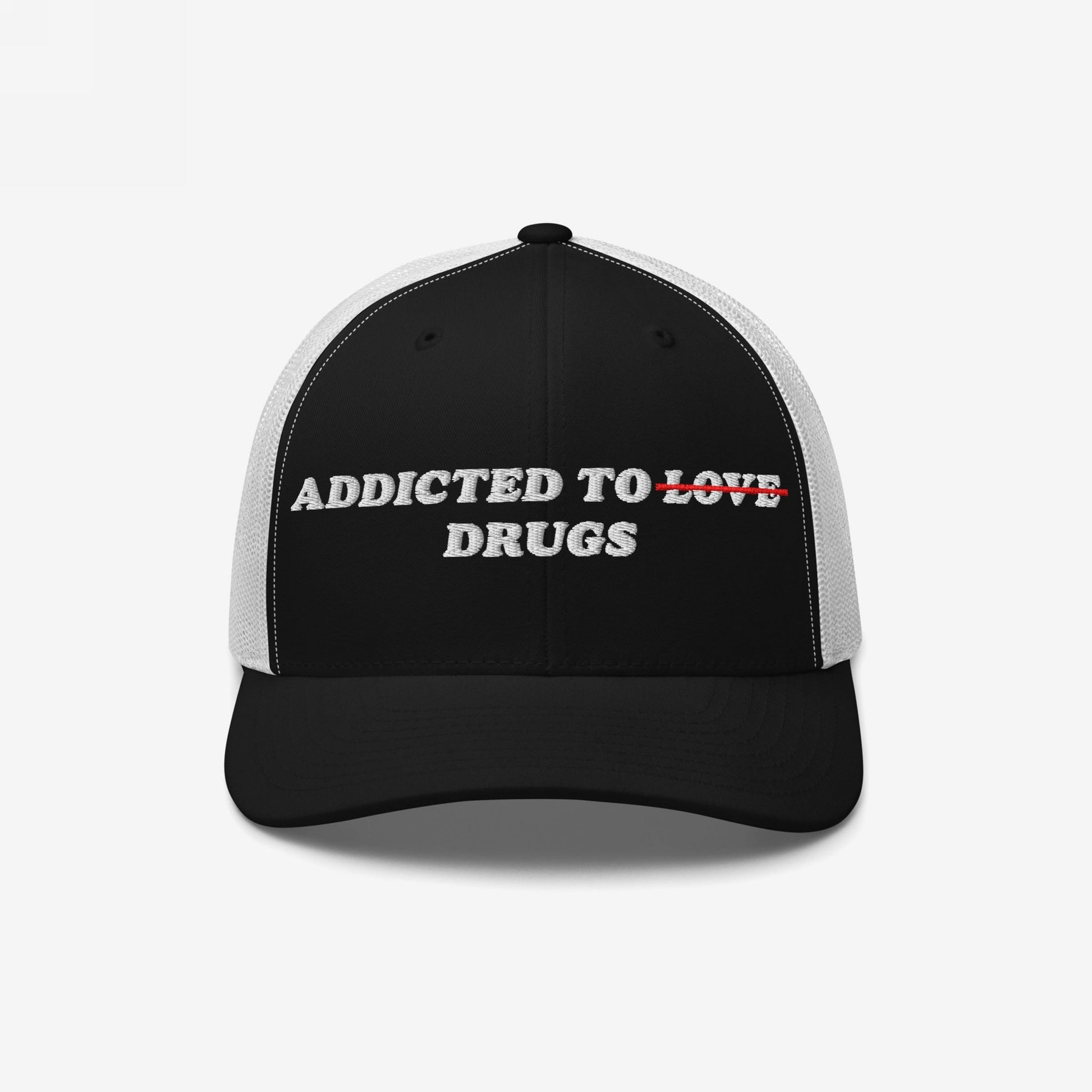 The Egoproof Addicted To Love / Drugs Hat is a striking black and white cap with LOVE crossed out in red and replaced by DRUGS, making a bold mental health statement.