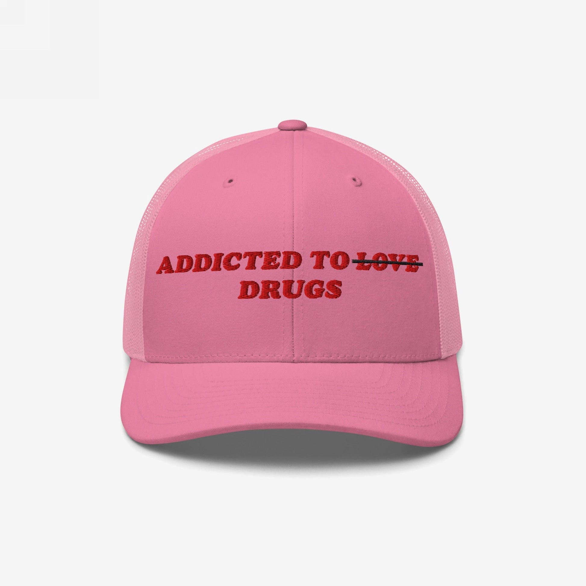The Egoproof Addicted To Love / Drugs Hat is a bold pink snapback with red embroidery that says ADDICTED TO ~LOVE~ DRUGS, with LOVE crossed out—a striking statement on mental health.