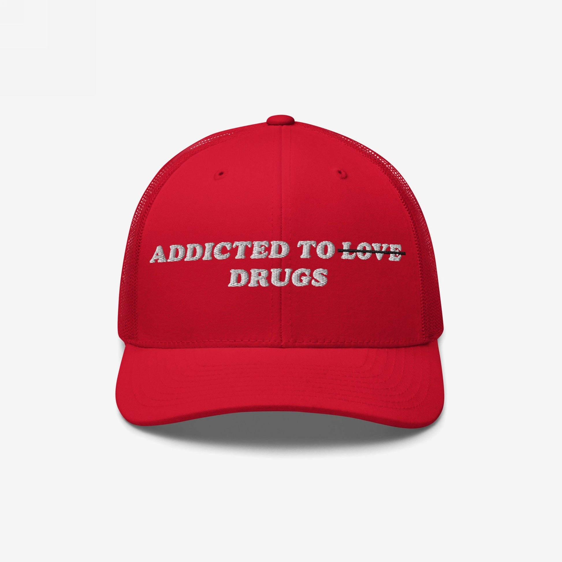 The Egoproof Addicted To Love / Drugs Hat is a red embroidered snapback with “ADDICTED TO ~LOVE~ DRUGS”—LOVE struck through and DRUGS below—making a bold, unique mental health statement.