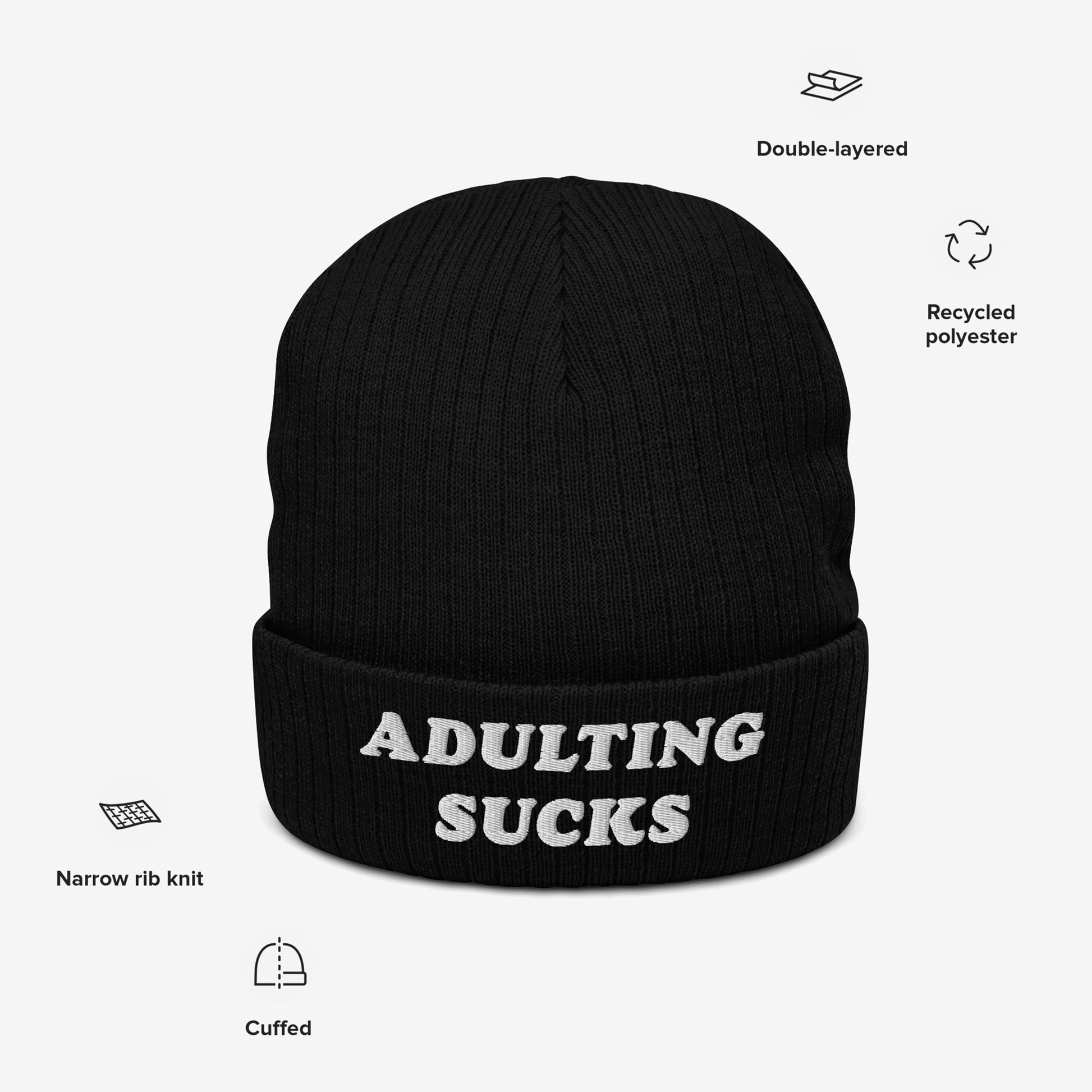 Adulting Sucks Hat: A black, cuffed knit beanie with ADULTING SUCKS in white embroidery, highlighting its double-layered recycled polyester and narrow rib knit design, embodying Egoproof's relatable, unapologetic style.