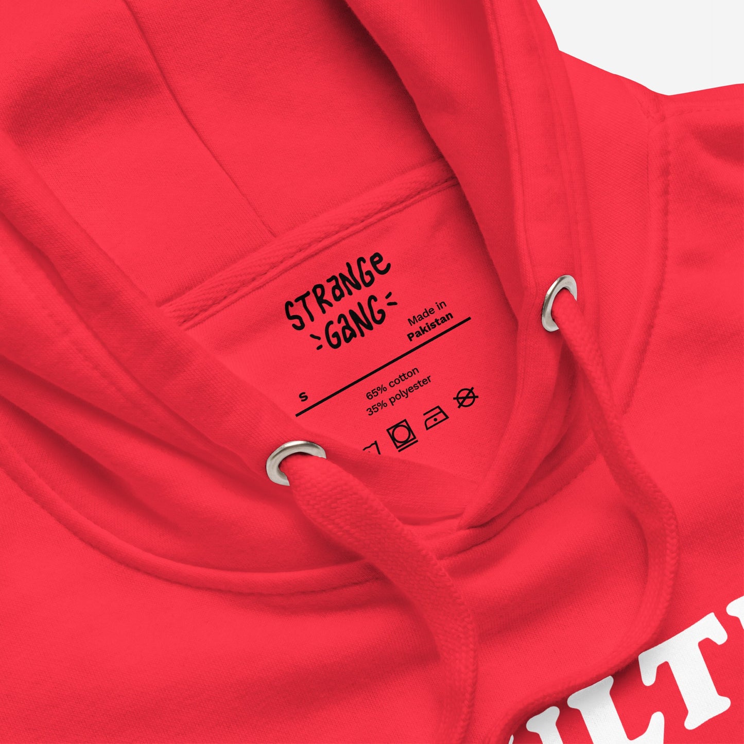 Adulting Sucks Hoodie EU, a red hoodie featuring a neck label detailing Made in Pakistan, size S, fiber content, care symbols, hood drawcords, and partial white graphic, embodies comfort for procrastinators.