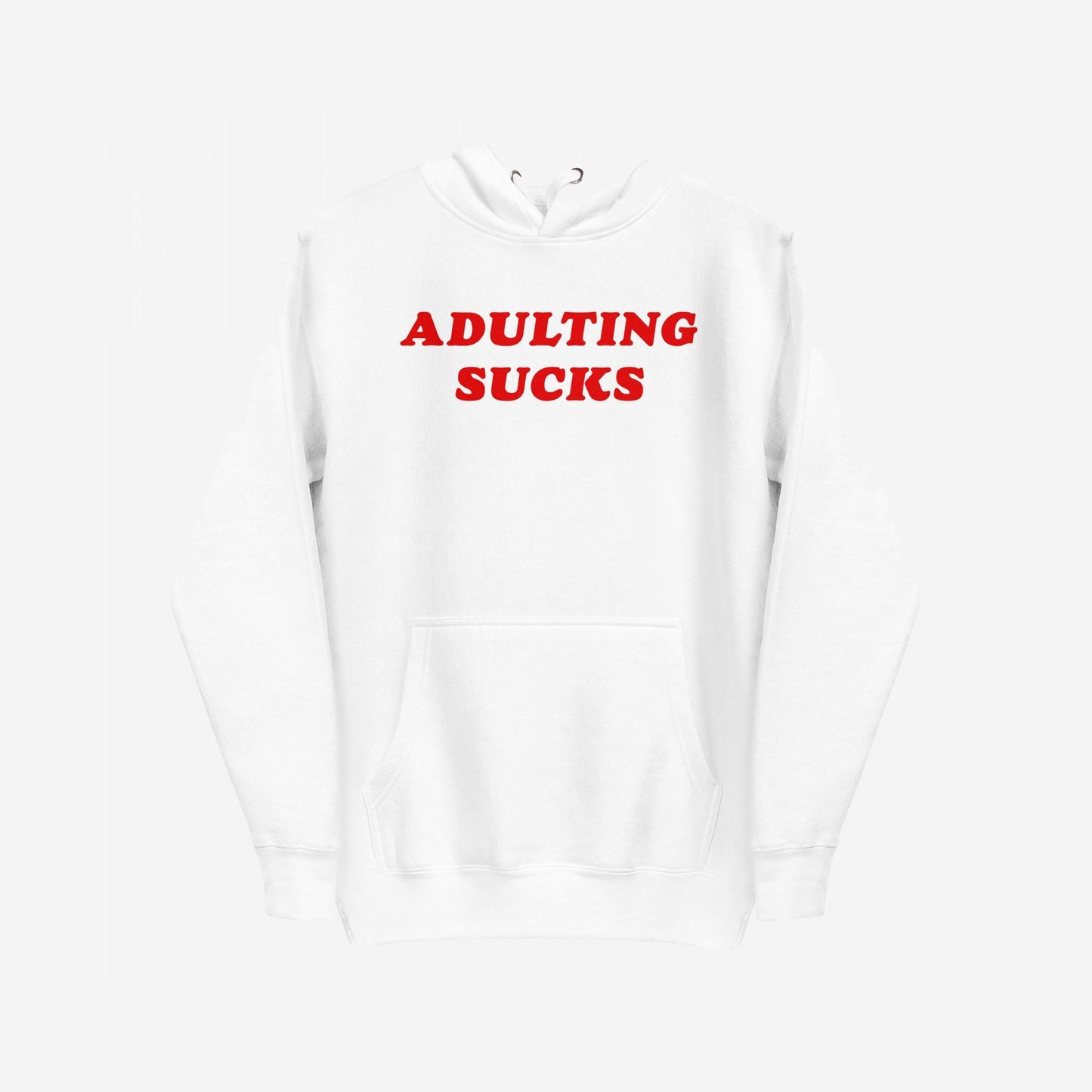 Adulting Sucks Hoodie EU features bold red ADULTING SUCKS text on a plain white hoodie with a kangaroo pocket. Perfect for those navigating modern life's challenges with humor.