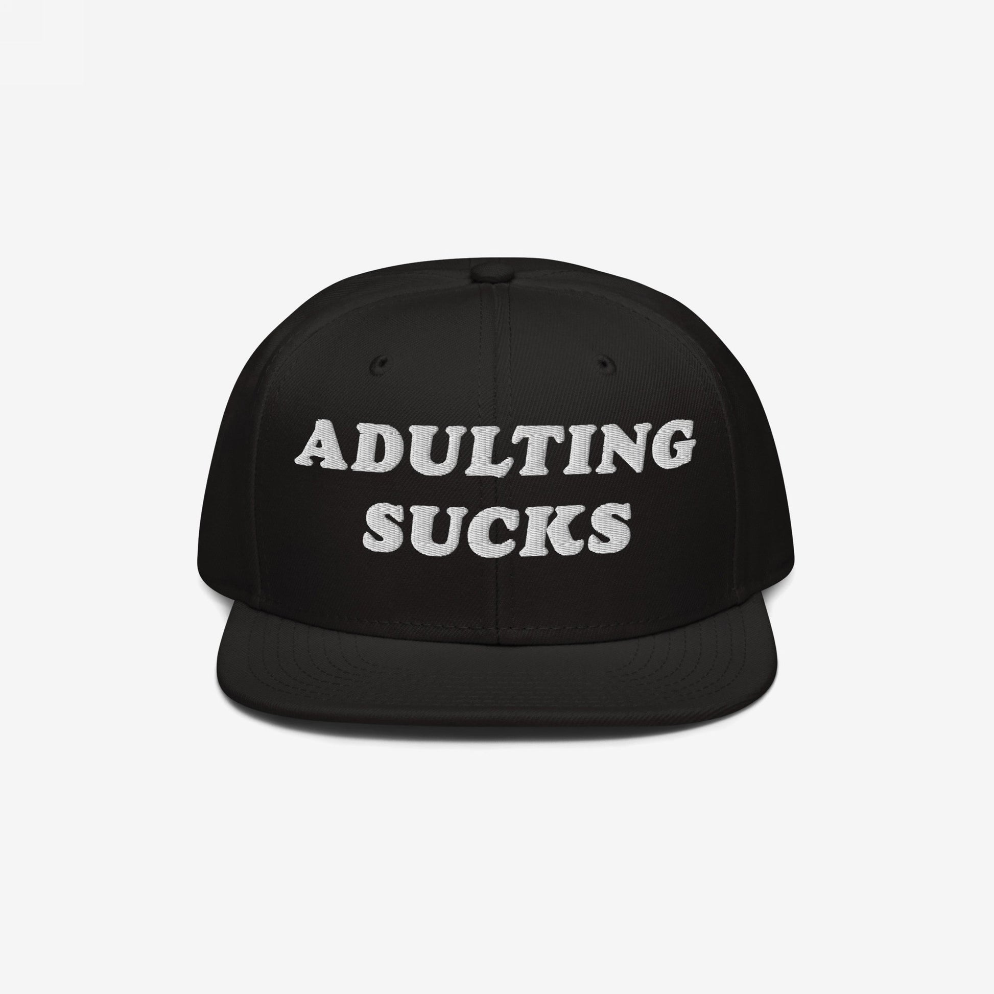 Adulting Sucks Hat featuring a black, flat-brimmed snapback design with “ADULTING SUCKS” embroidered in white. Perfect for expressing the trials of modern life with a stylish, honest flair.