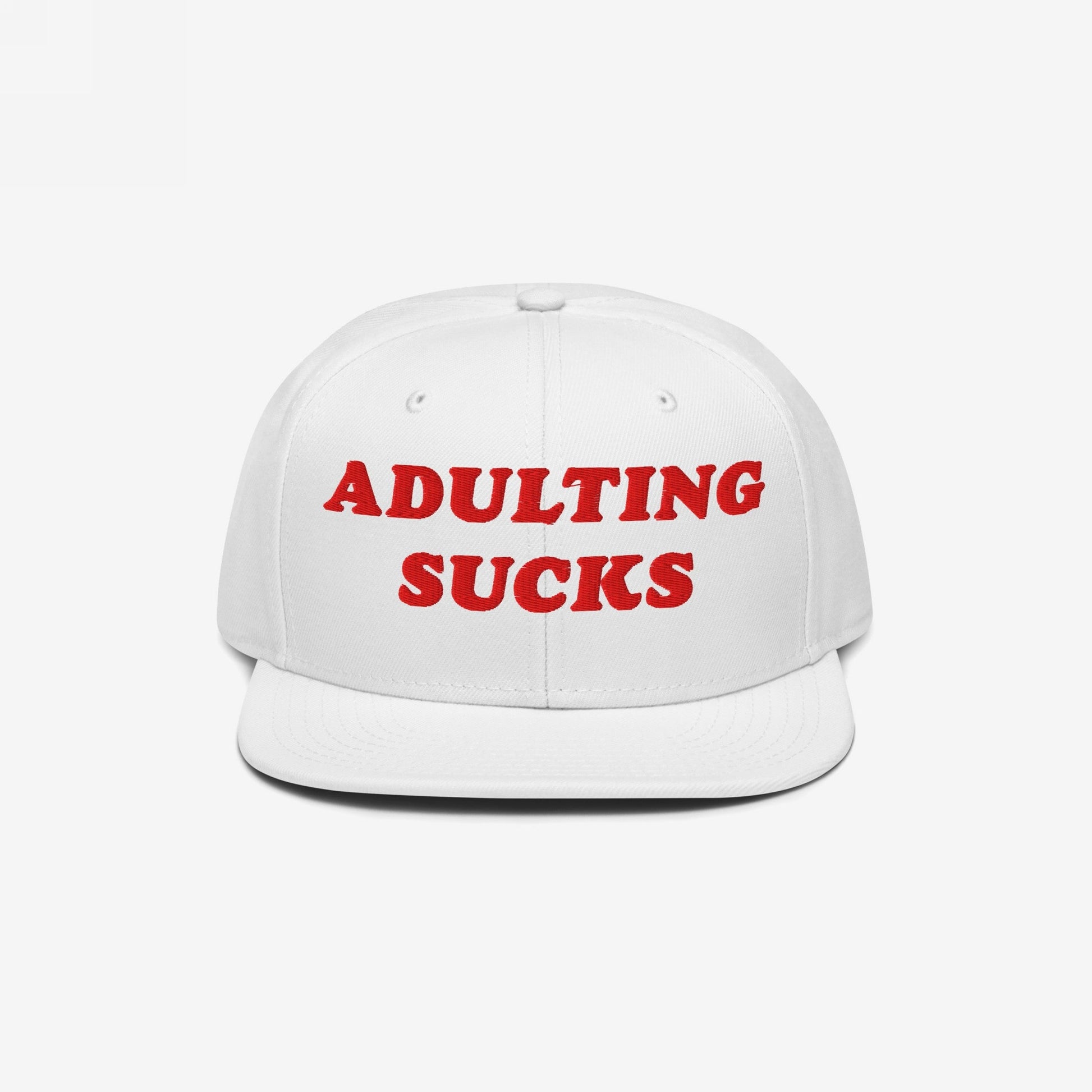 Adulting Sucks Hat: A white snapback cap with bold red embroidery declaring “ADULTING SUCKS,” capturing a vintage-inspired, honest sentiment for those overwhelmed by life’s pressures.