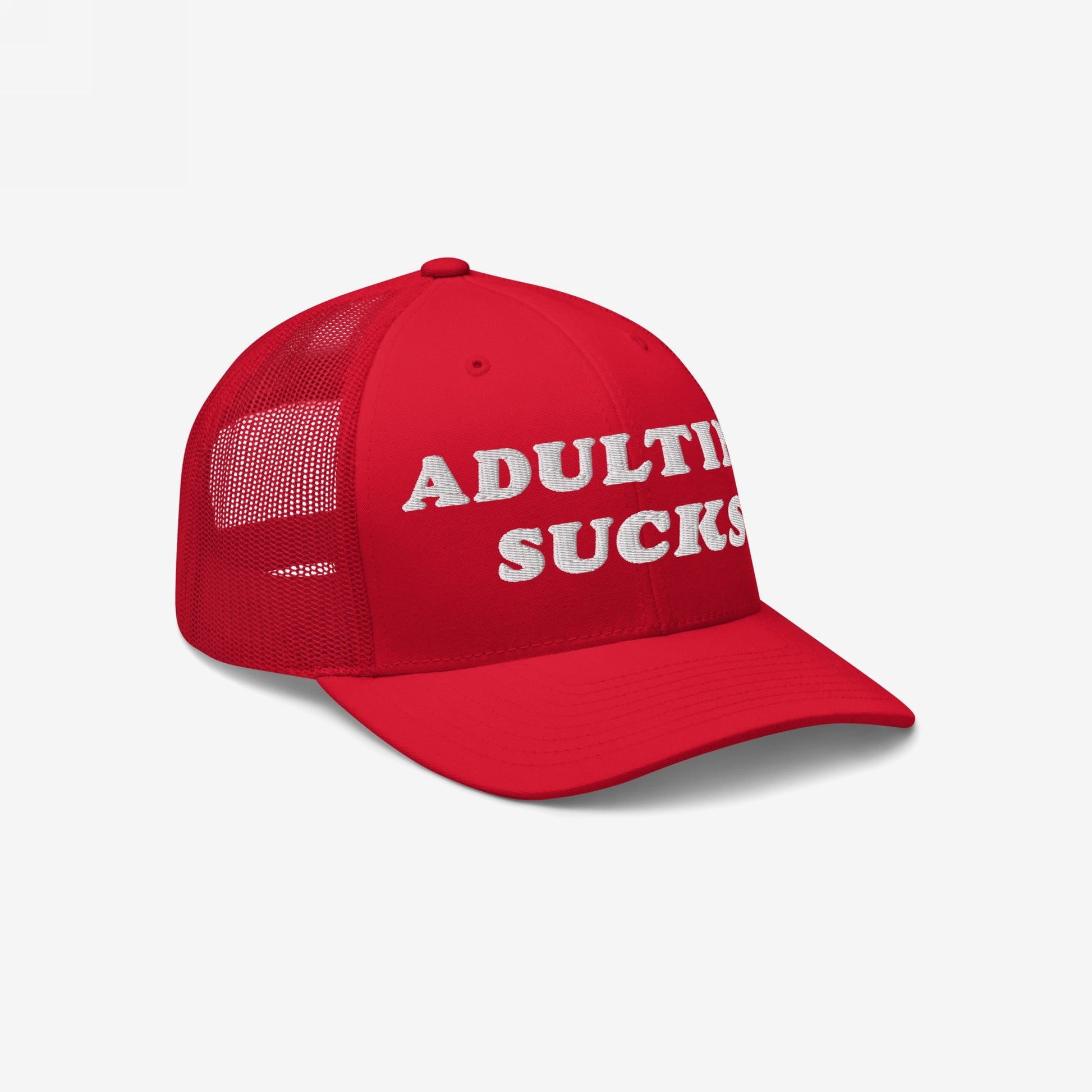 The Adulting Sucks Hat features a bold red mesh-back design with ADULTING SUCKS embroidered in white. Ideal for expressing millennial frustrations, this trucker-style cap is both stylish and brutally honest.