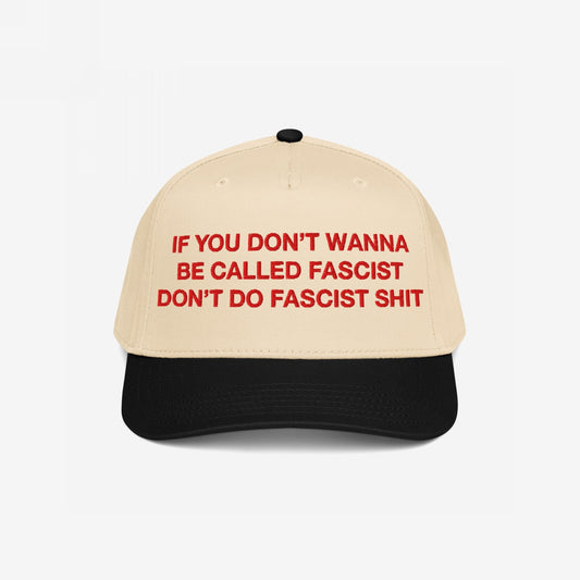 Anti-Fascist Hat with beige crown and black brim, featuring bold red embroidery: If you don’t wanna be called fascist, don’t do fascist shit, embodies Egoproof's stand against hate and injustice.