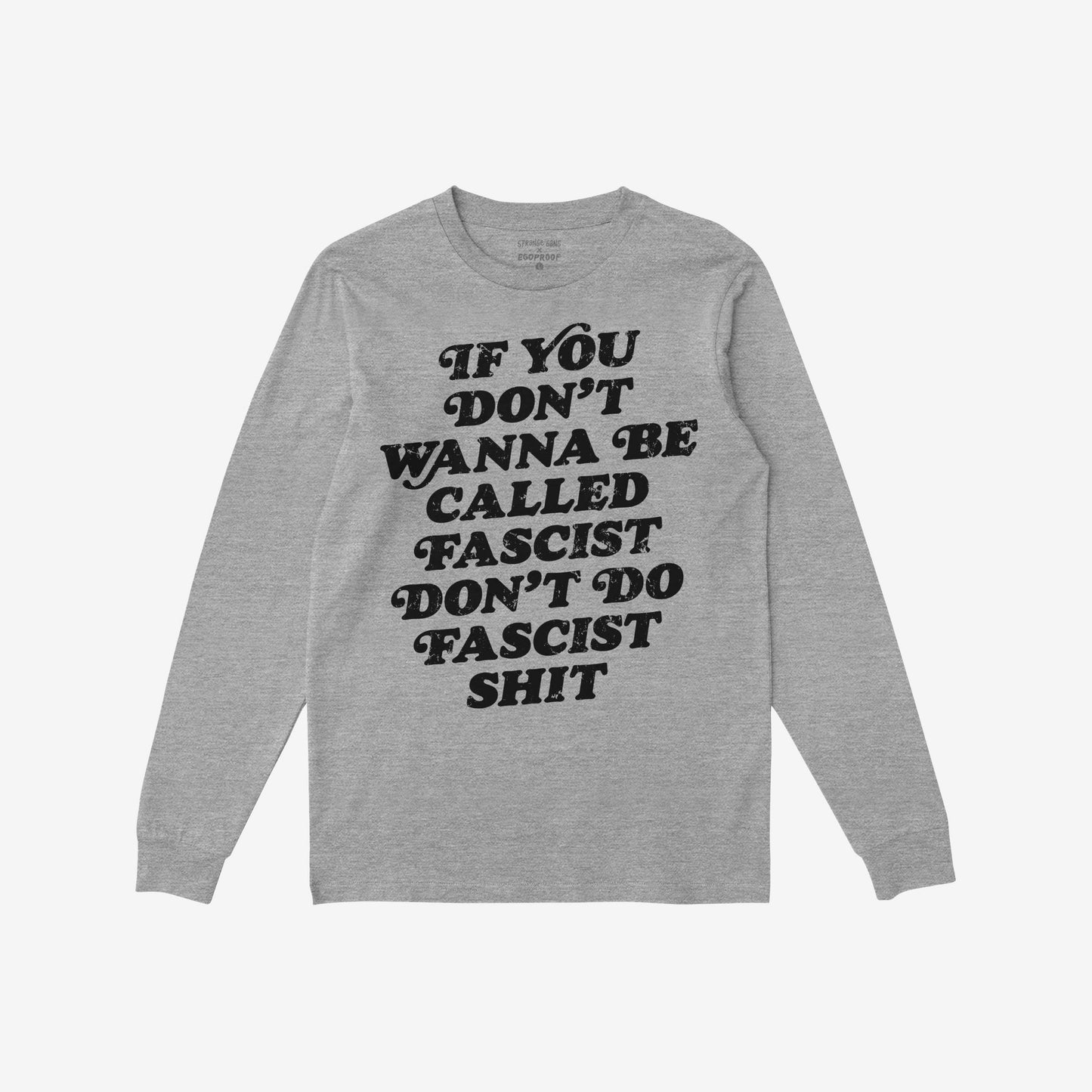 Anti-Fascist T-shirt: Heather-gray long-sleeve tee featuring a bold black message, “If you don’t wanna be called fascist don’t do fascist shit,” symbolizing defiance and resistance against hate and injustice.