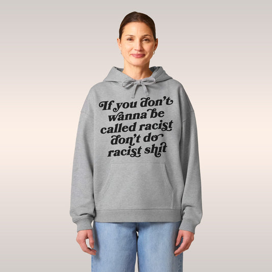 Anti-Racist Hoodie featuring a bold white script message on the chest, with a front kangaroo pocket. Designed for comfort and