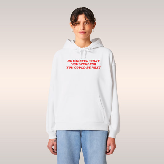 Young man wearing a white Be Careful Hoodie with red text warning about social justice and activism.