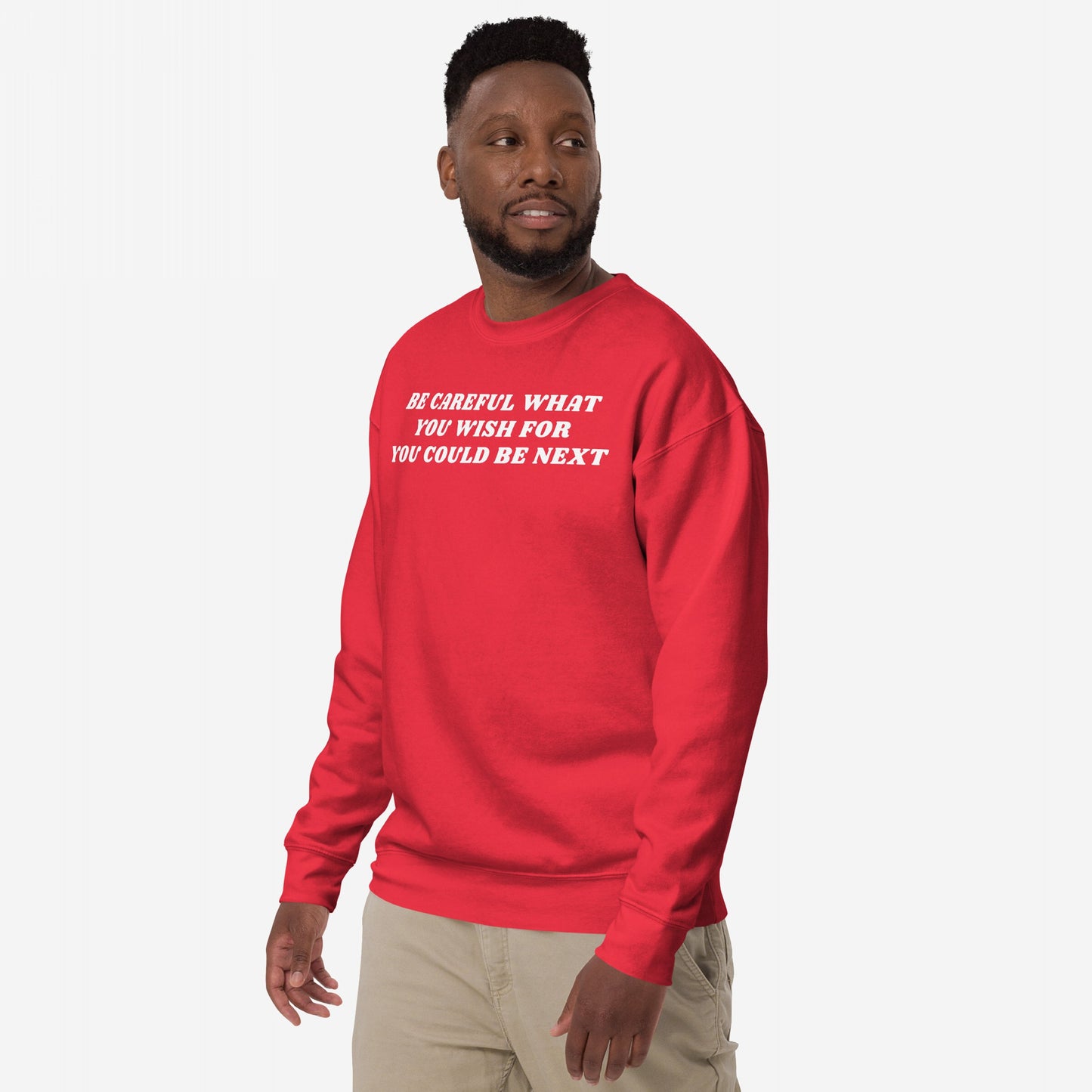 Man in Be Careful Sweatshirt EU with bold protest message, standing confidently in light pants. The sweatshirt embodies activism and resistance, aligning with Egoproof's powerful, statement-driven apparel ethos.