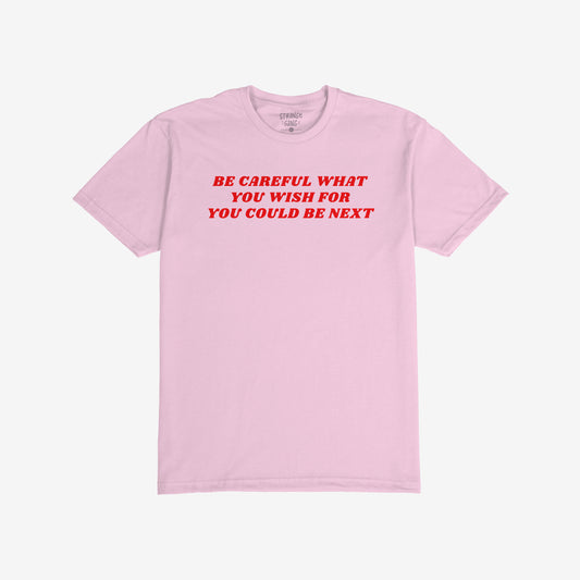Be Careful T-shirt in pink with bold red text reading "Be Careful What You Wish For You Could Be Next," unisex activist tee.