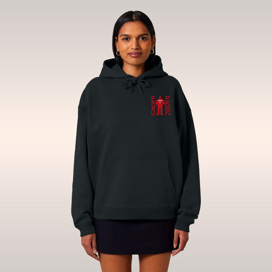 Young person in a black Fucks To Give Hoodie with a red chest graphic, denim shorts, and white sneakers, embodying Egoproof's