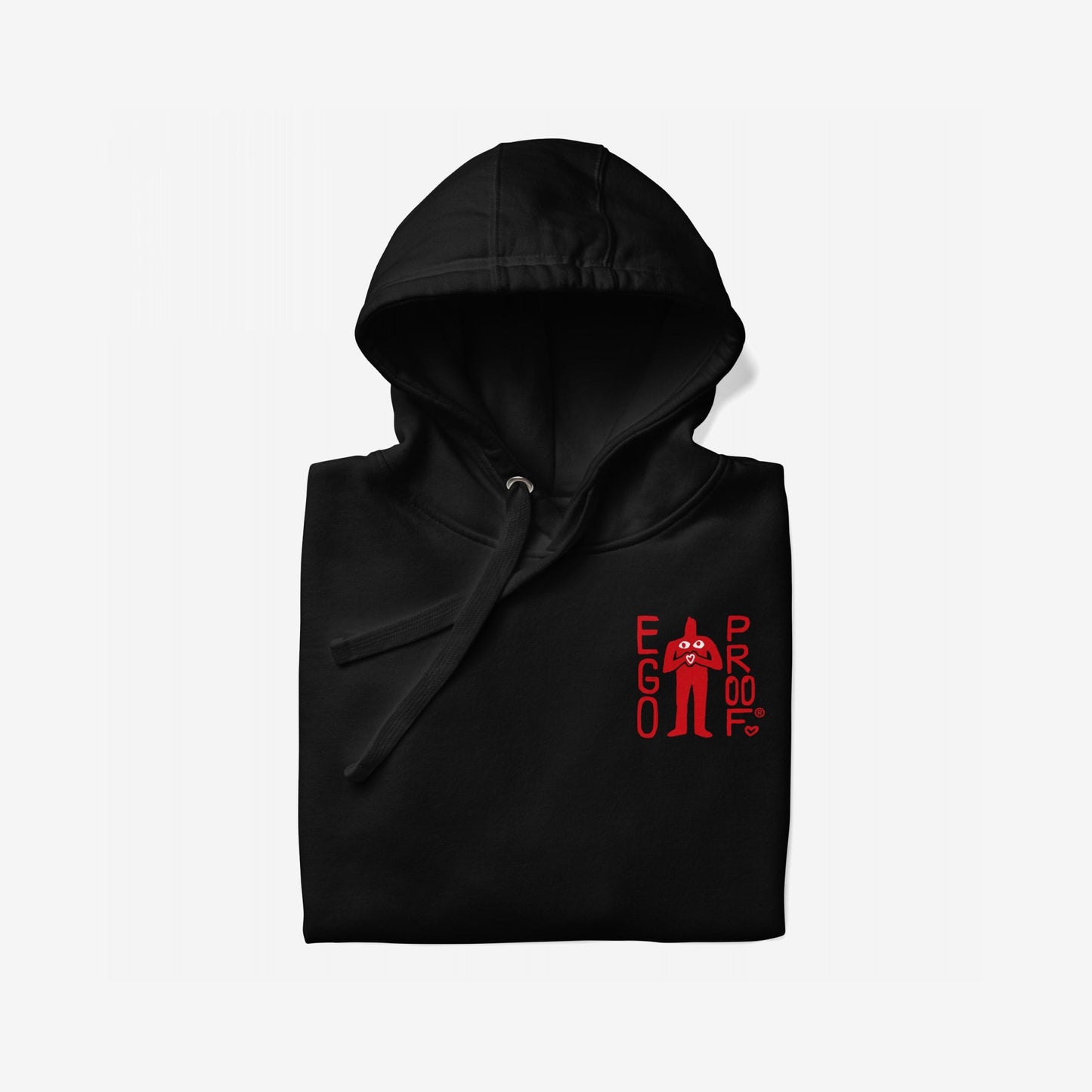 Folded black Fucks To Give Hoodie EU with red EGO PROOF graphic on chest, featuring abstract silhouette. Back displays bold statement on embracing apathy, perfect for stylish self-care days.