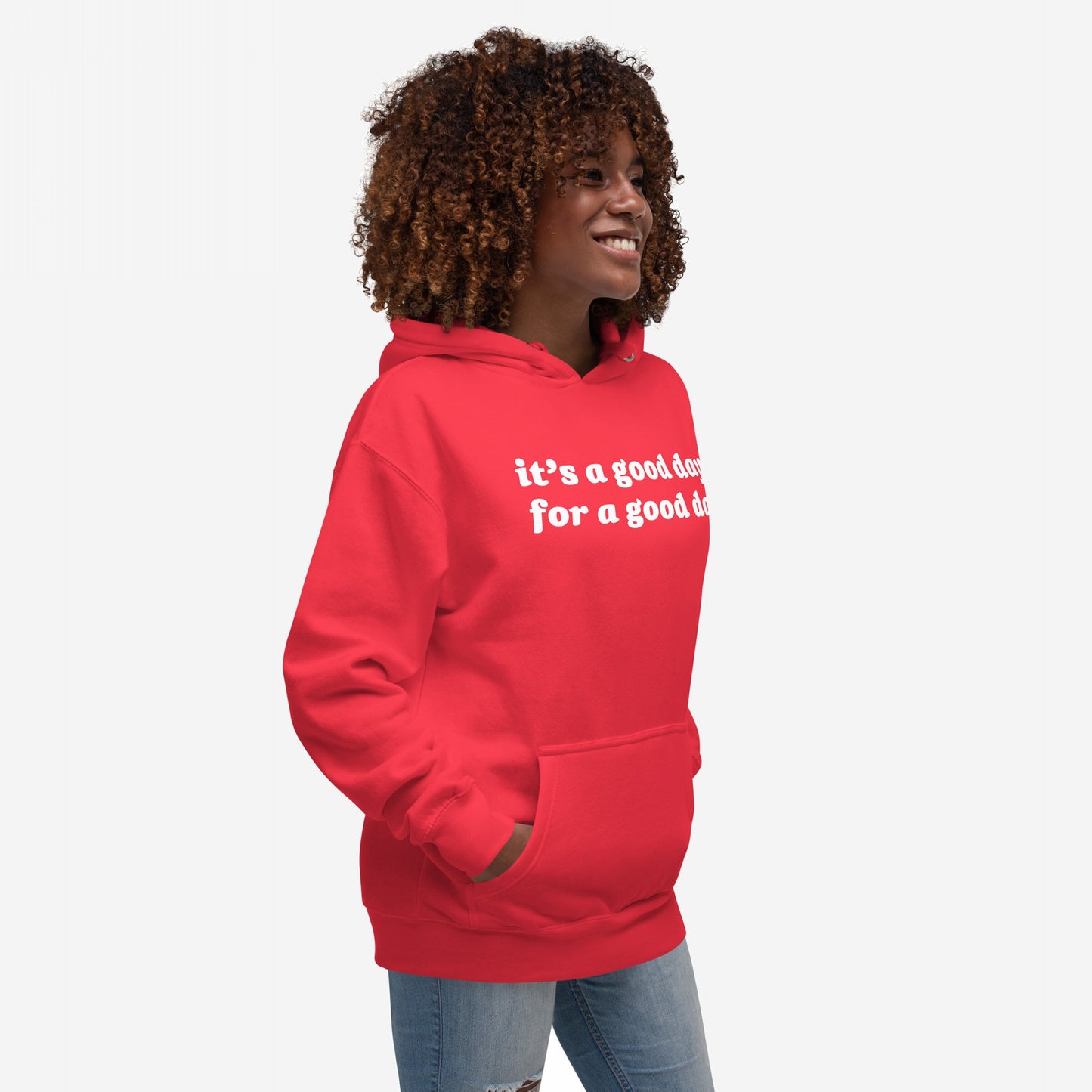 A person smiles wearing the Good Day Hoodie EU, featuring the phrase it's a good day for a good day. This cozy, optimistic hoodie is designed for mindful mornings and supporting mental health awareness.