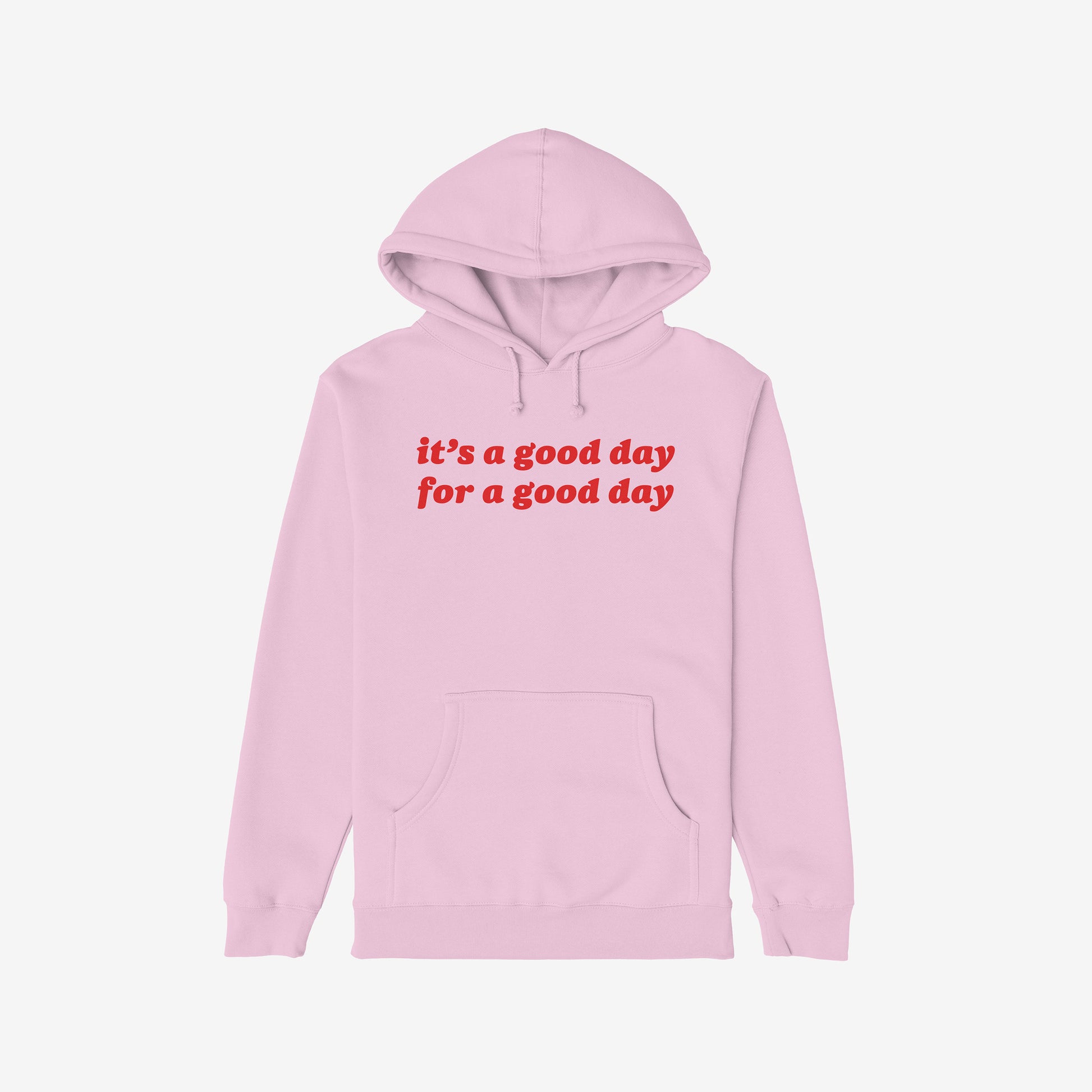 Good Day Hoodie: A light pink pullover with a comforting message, “it’s a good day for a good day” in bold red on the chest, featuring a kangaroo pocket and drawstring hood.