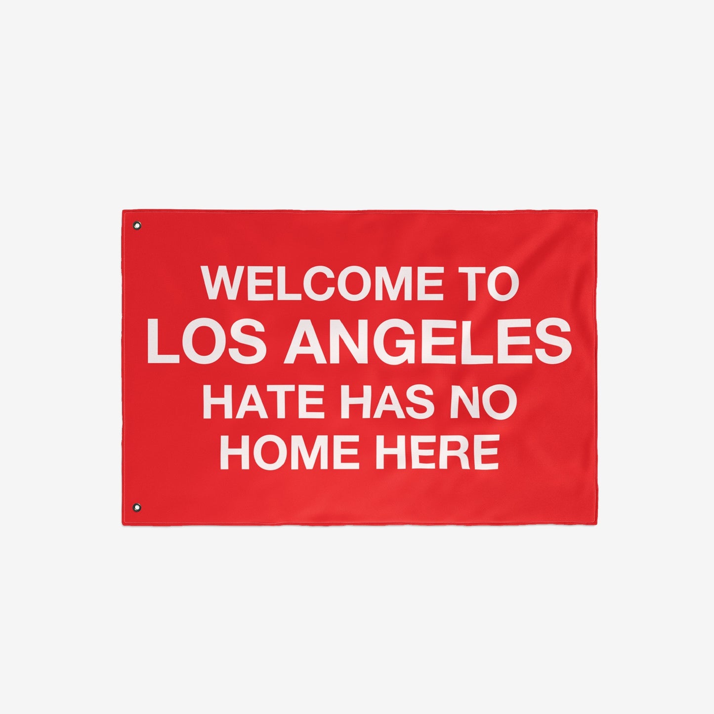 Custom Hate Has No Home Here Flag featuring bold white text on a red background, inviting customization with a city name, promoting unity and acceptance. Ideal for homes and public spaces.