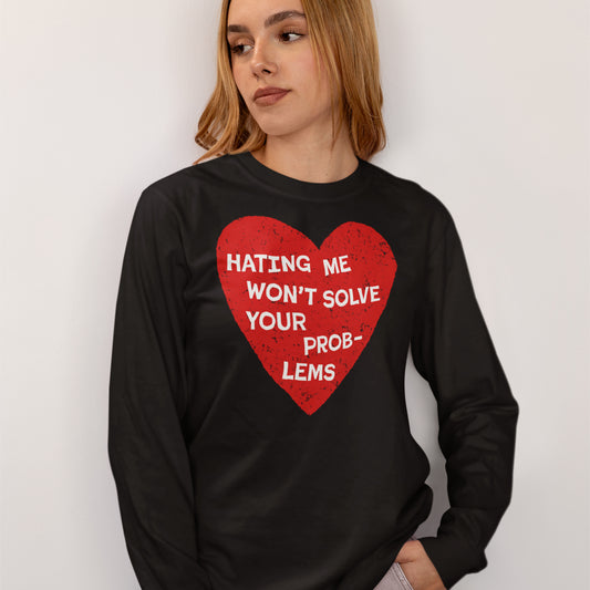 Woman wearing black No Hate Long Sleeve T-shirt with red heart and bold white text message on front.