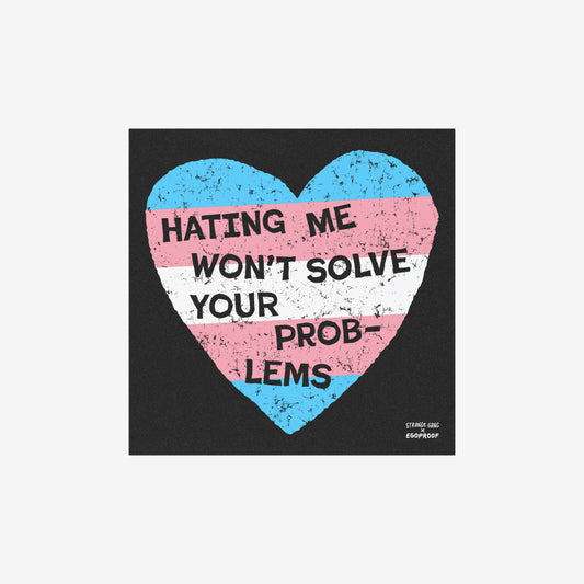 No Trans Hate Sticker & Magnet featuring a distressed trans flag heart with "Hating Me Won't Solve Your Problems" text on black background.
