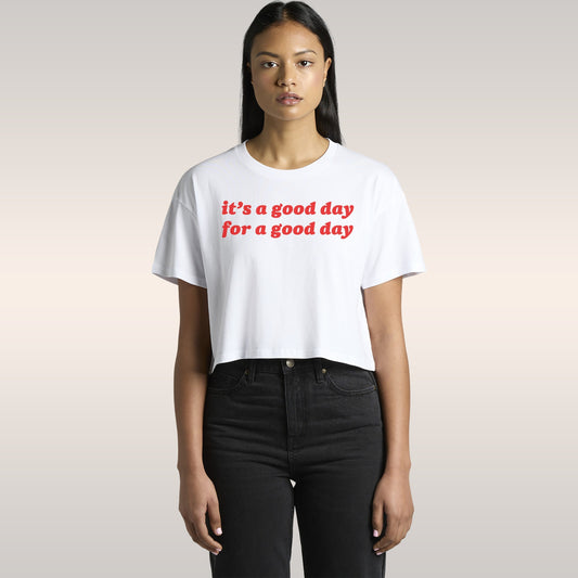 Good Day Women's Baby Tee: A young woman in a car wears this cropped T-shirt, printed with it's a good day for a good day, pa