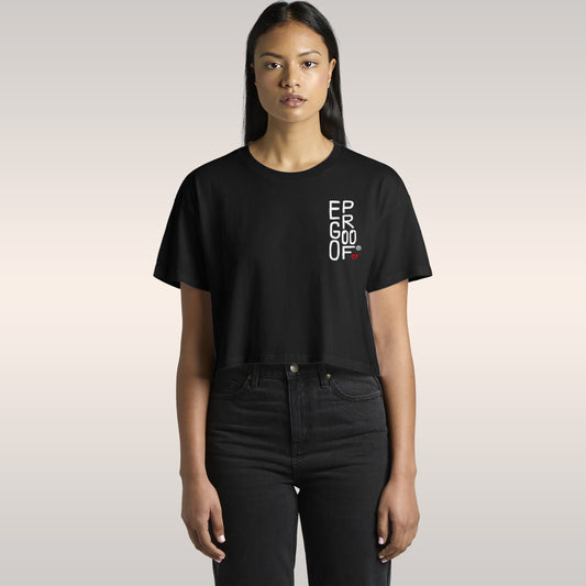 Make Art Every Day Women's Baby Tee in black with small white text logo, cropped fit paired with high-waisted dark jeans on m
