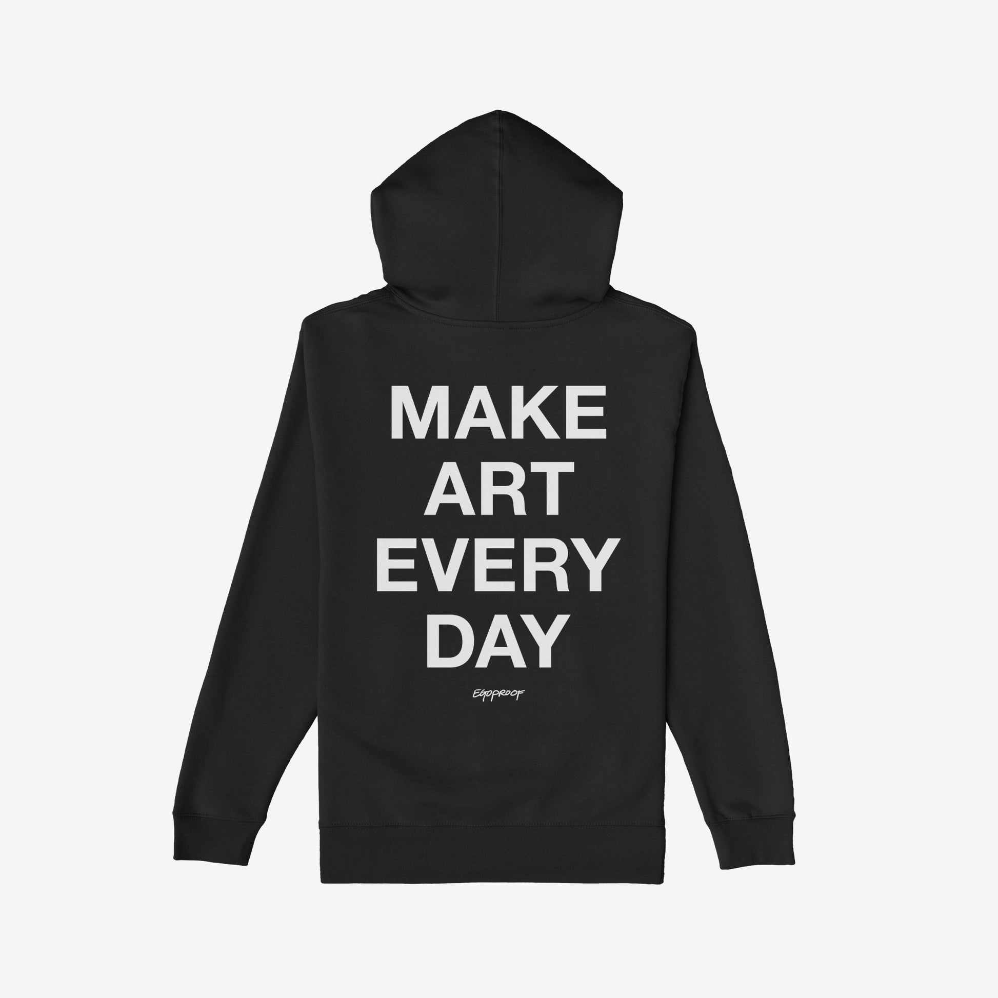 Black Make Art Every Day Hoodie, back view, featuring bold white lettering down the center. A small designer signature appears beneath. Ideal for creatives seeking warmth and inspiration.