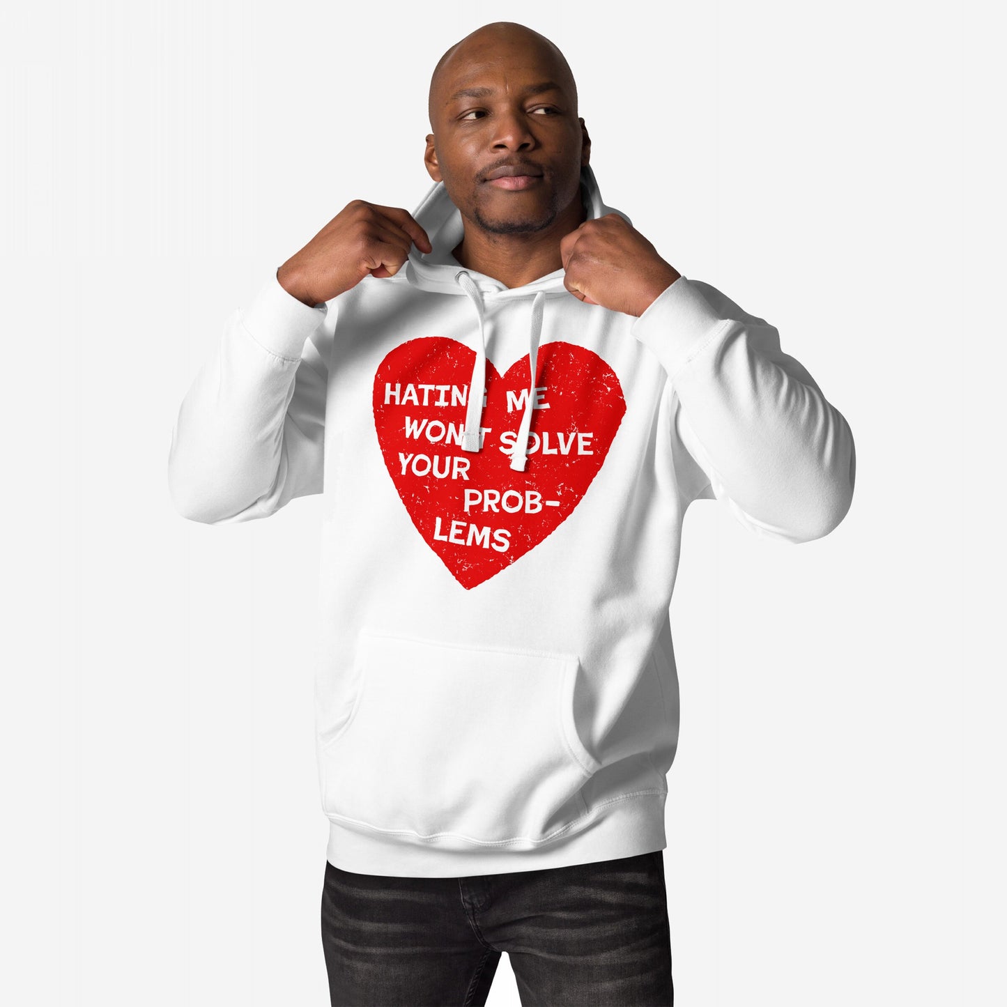 Person wearing the No Hate Hoodie EU with a distressed red heart and bold message, Hating Me Won’t Solve Your Problems, tugging drawstrings; embodies activism and comfort from Egoproof.
