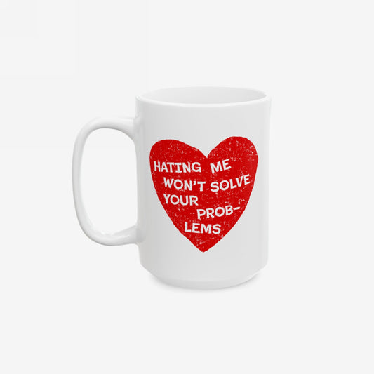 No Hate Mug featuring “Hating Me Won’t Solve Your Problems” quote over a red heart on a white ceramic coffee mug.