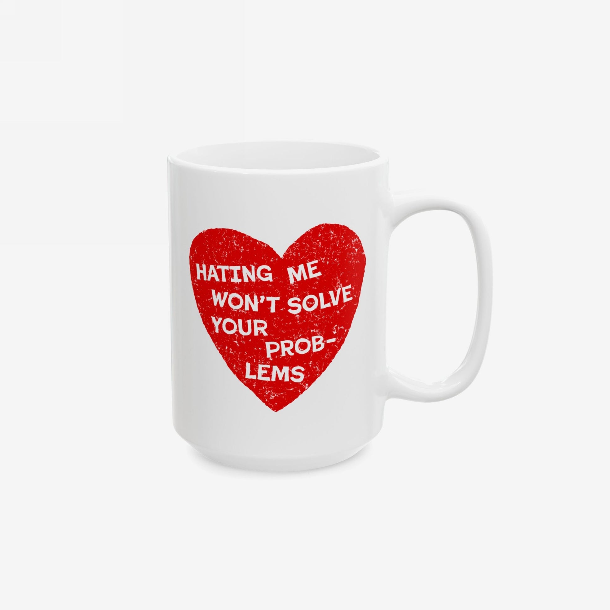 White ceramic No Hate Mug with red heart and the quote "Hating Me Won't Solve Your Problems" printed on the side.
