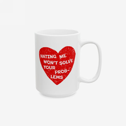 White ceramic No Hate Mug with red heart and the quote "Hating Me Won't Solve Your Problems" printed on the side.
