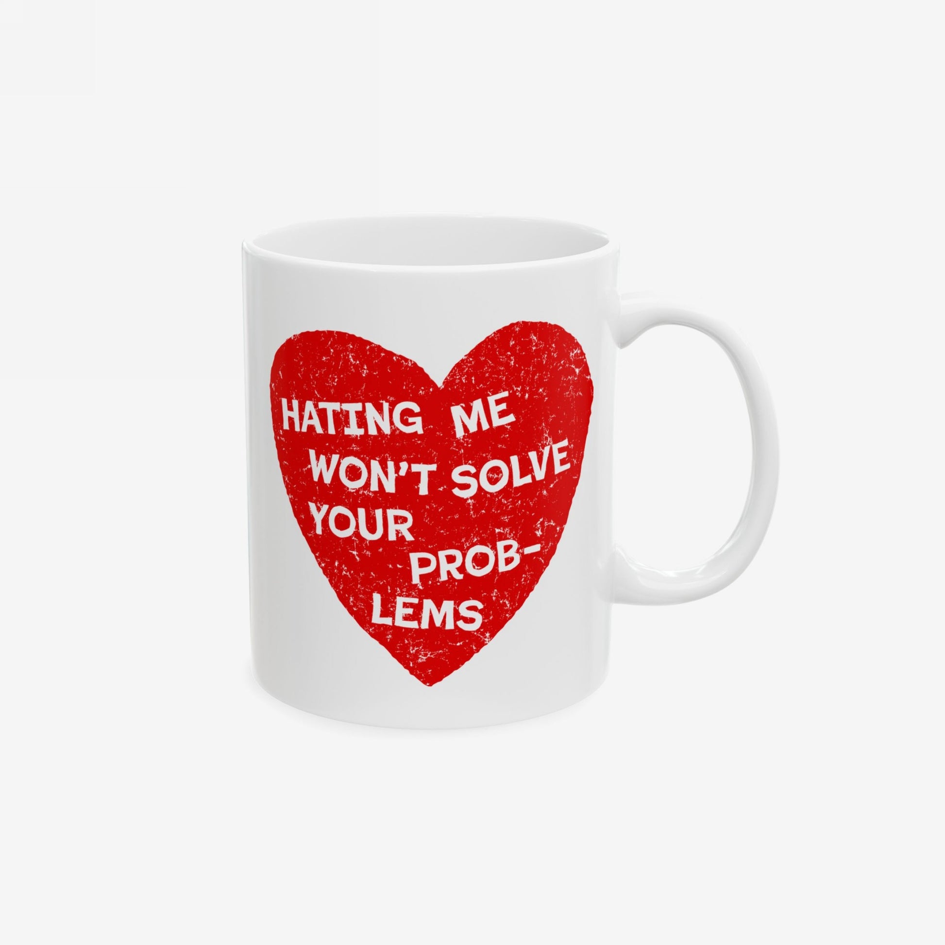 No Hate Mug with red heart and white text "Hating Me Won't Solve Your Problems" on white ceramic coffee cup.