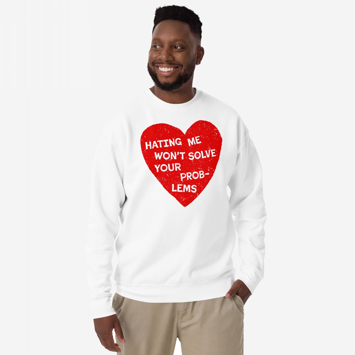 Man wearing the No Hate Sweatshirt EU, featuring a distressed red heart with the phrase “Hating Me Won’t Solve Your Problems.” Unisex, bold, and midweight, it embodies resilience and advocacy.