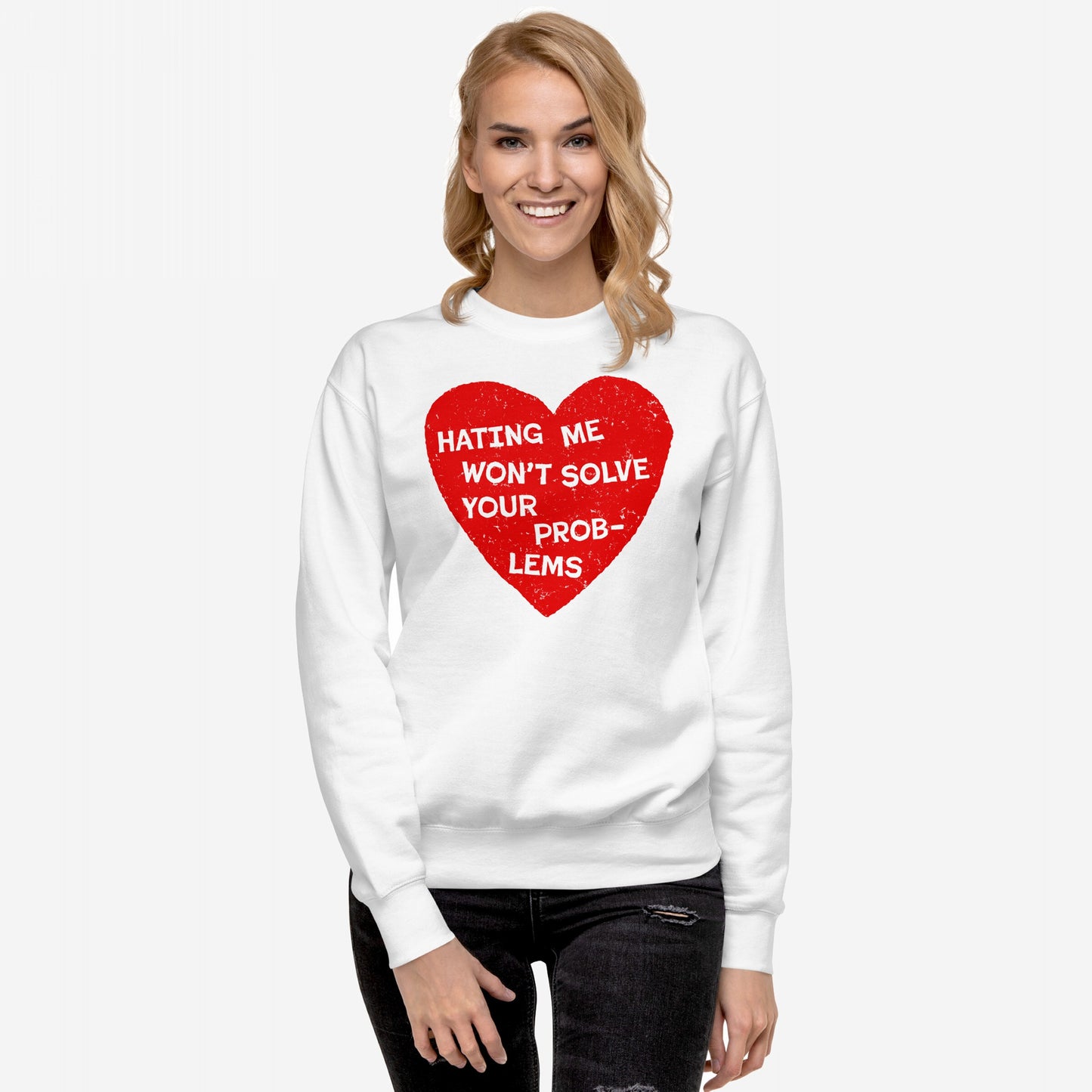 Woman in white No Hate Sweatshirt EU featuring a bold red heart with the message “HATING ME WON’T SOLVE YOUR PROBLEMS,” embodying self-expression and resilience.
