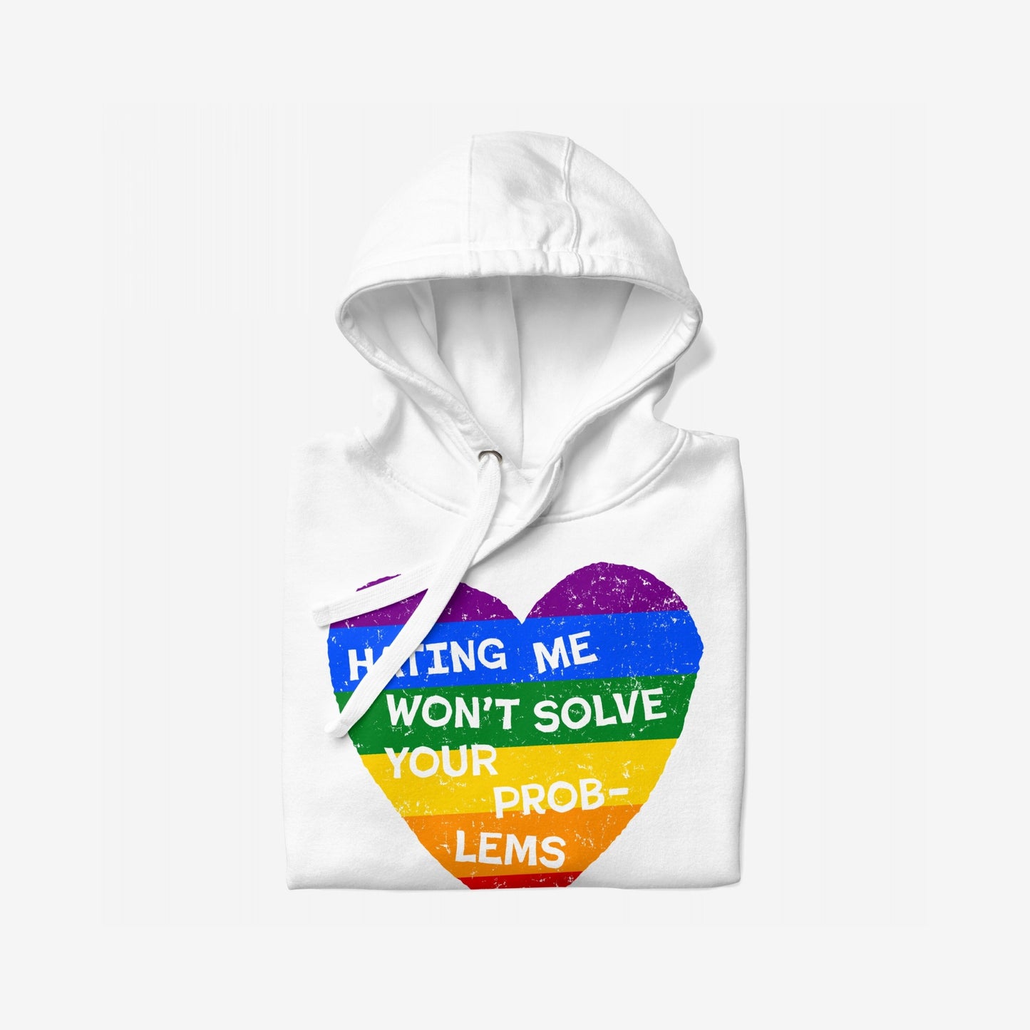 No LGBTQ Hate Hoodie EU: Folded white hoodie with rainbow-striped heart graphic and bold slogan “Hating Me Won’t Solve Your Problems,” reflecting defiance and pride. Designed for comfort and impactful expression.