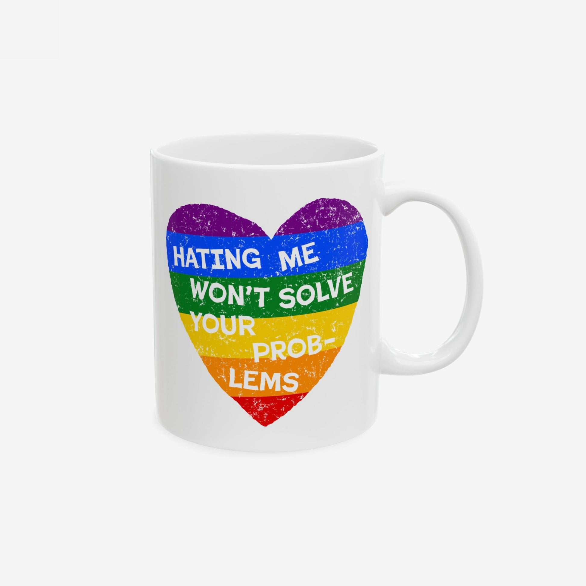 White ceramic mug with rainbow heart and quote "Hating Me Won't Solve Your Problems" printed, No LGBTQ Hate Mug.