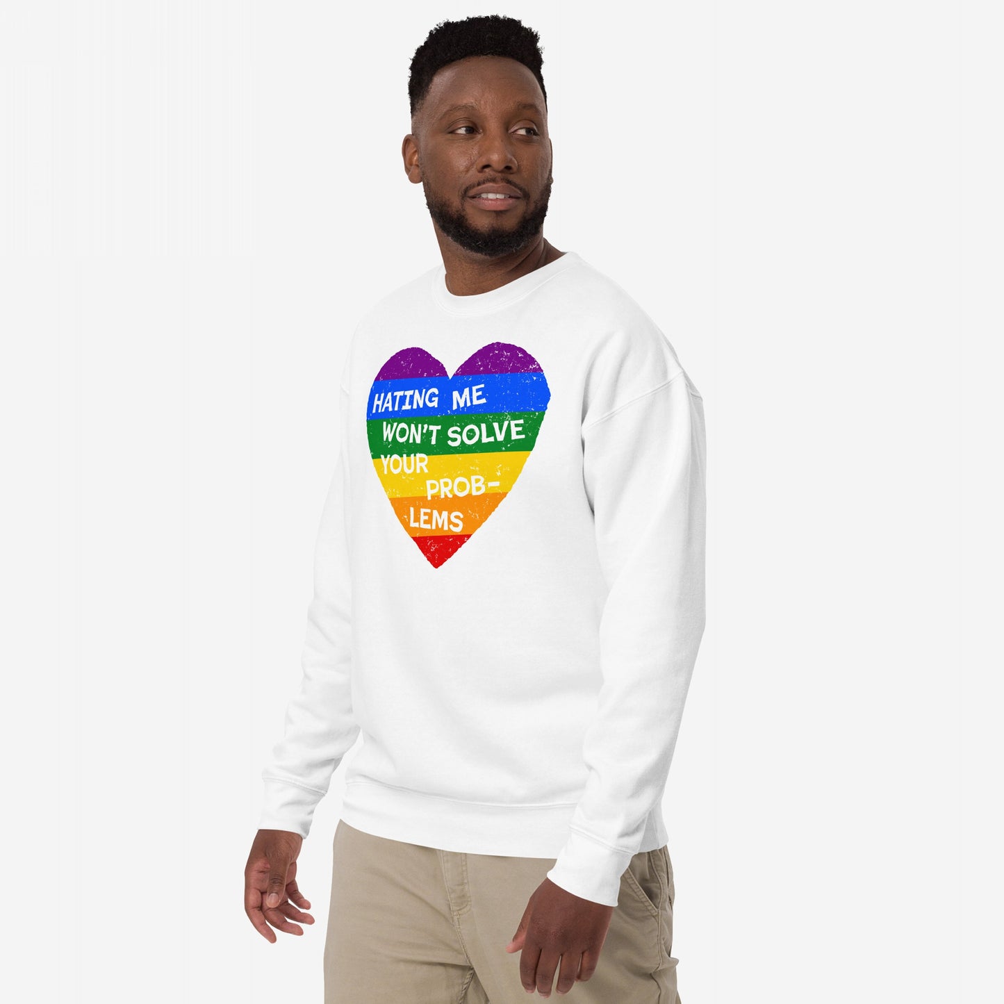 Man wearing the No LGBTQ Hate Sweatshirt EU, featuring a rainbow-striped heart with the slogan “HATING ME WON’T SOLVE YOUR PROBLEMS,” symbolizing resilience and LGBTQ+ pride against a white background.