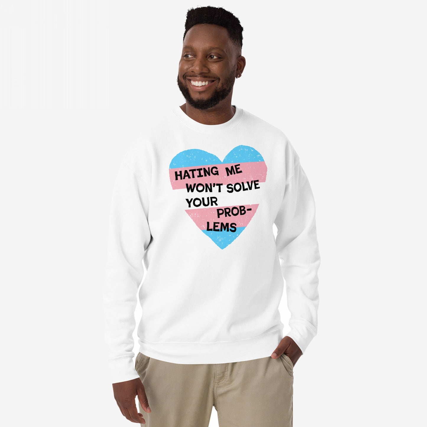 No Trans Hate Sweatshirt EU features a man in a white sweatshirt with a heart graphic and bold message, symbolizing trans pride and visibility with a statement against hate.