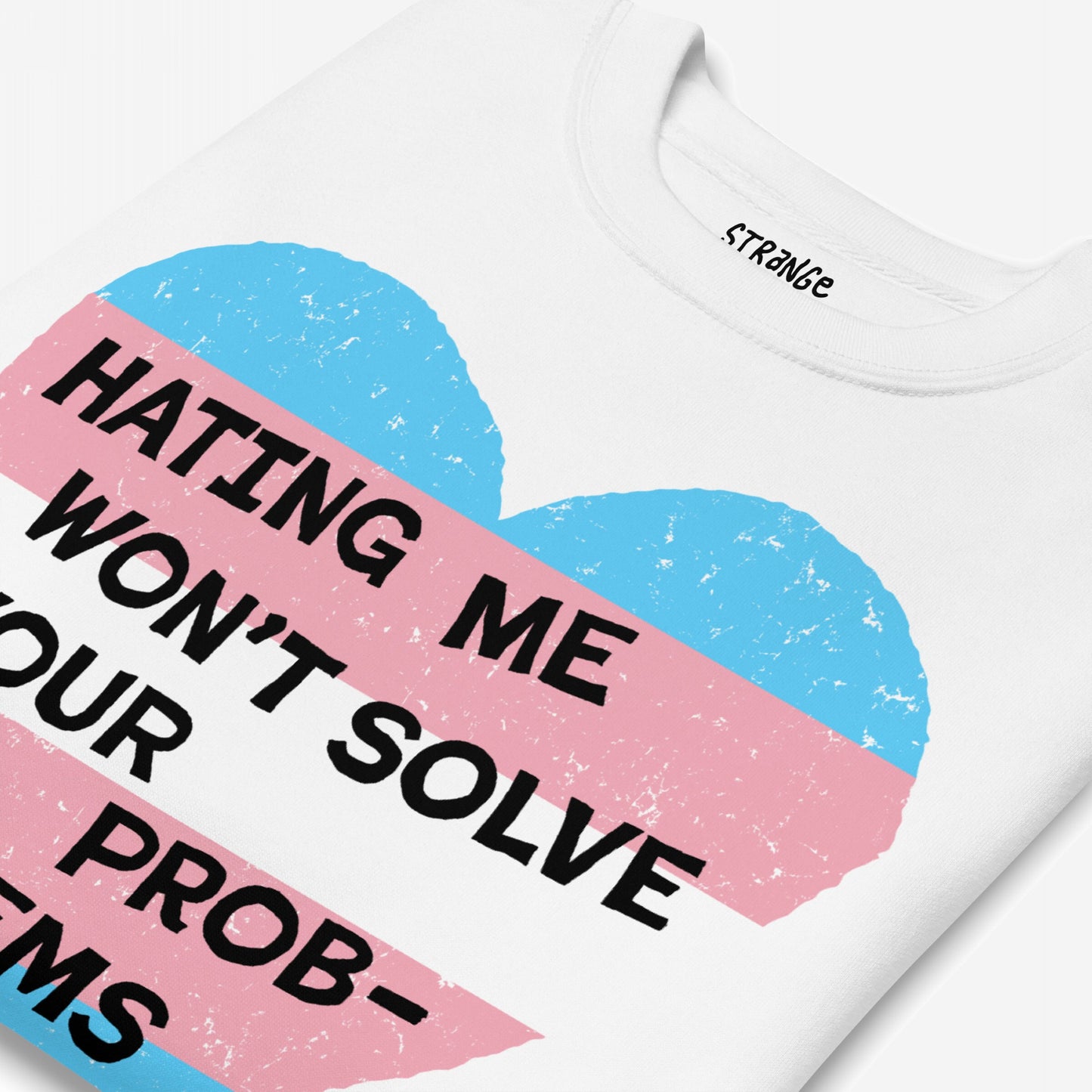 No Trans Hate Sweatshirt EU featuring a pink and light blue heart graphic with the slogan “HATING ME WON’T SOLVE YOUR PROBLEMS.” on a white T-shirt, symbolizing trans pride and empowerment.