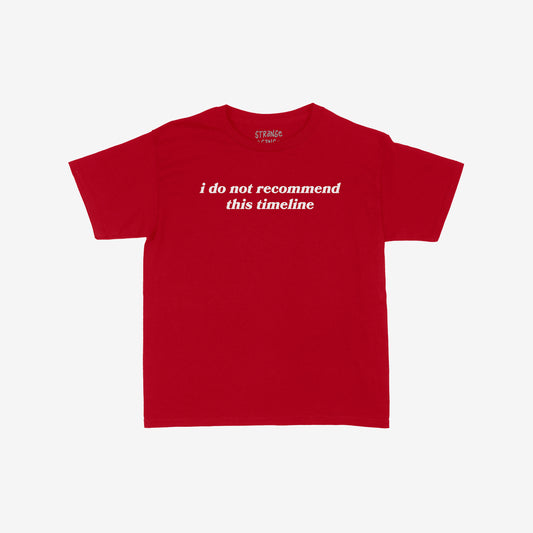 Timeline Women's Baby Tee red cropped shirt with "i do not recommend this timeline" text in white across front