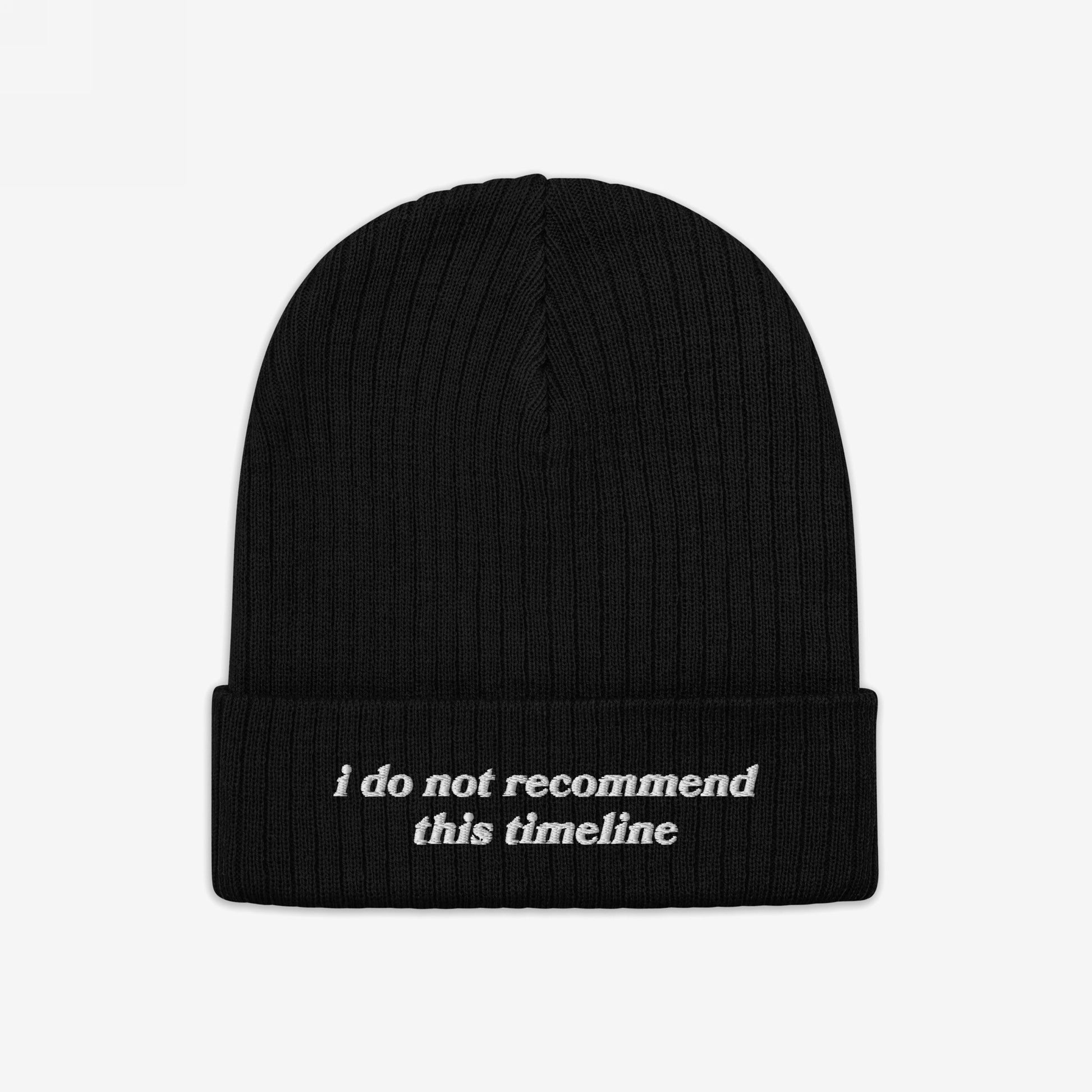 A black rib-knit Timeline Hat with a folded cuff, featuring white embroidered text: “i do not recommend this timeline.” Perfect for those embracing sarcasm amidst life's chaos.