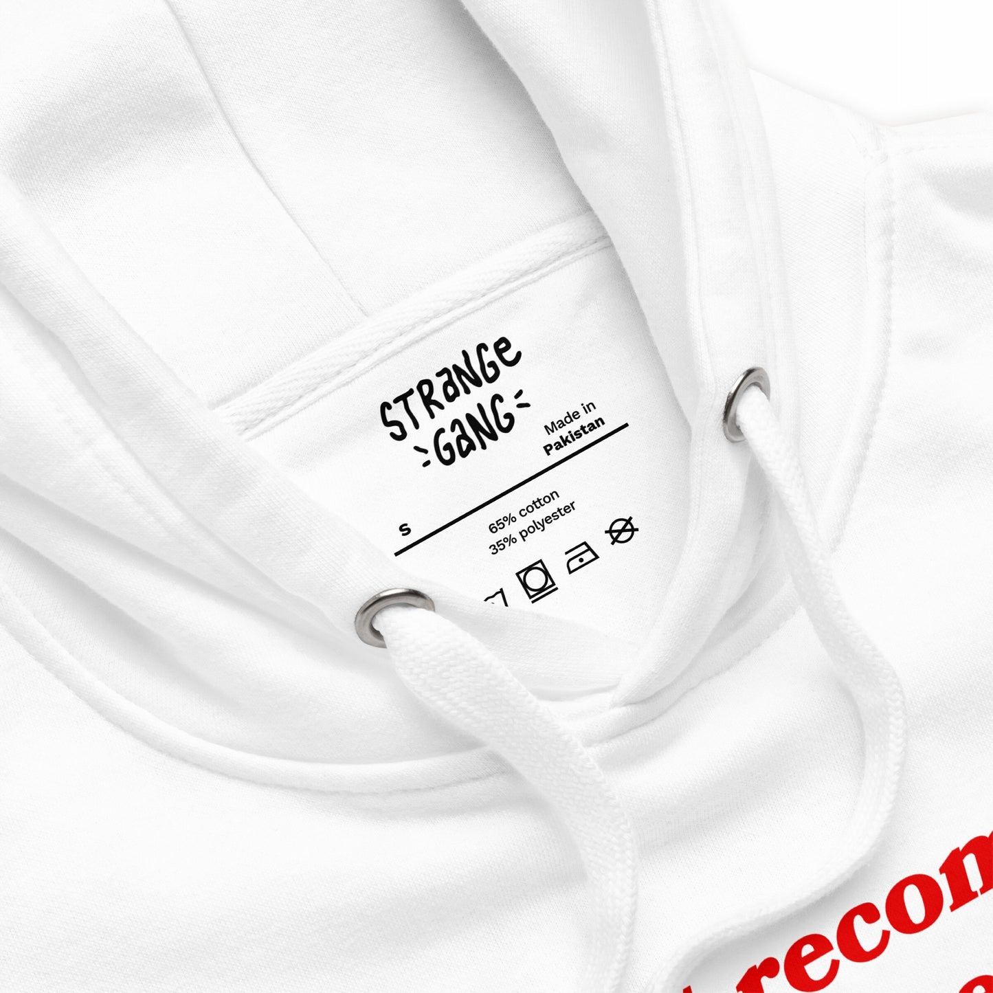 Close-up of the Timeline Hoodie EU's white fabric, showcasing the inner label details, highlighting its origin and materials. Ideal for those navigating life's challenges in comfort and style.