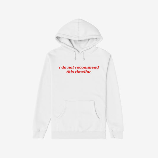 White Timeline Hoodie with red text "i do not recommend this timeline" in a regular fit, midweight, unisex style.
