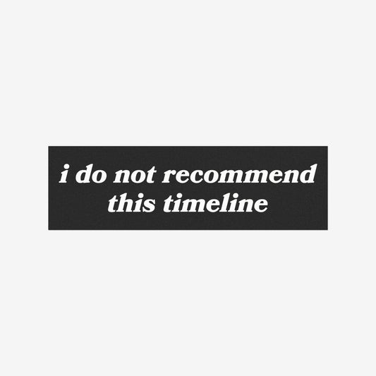 Timeline Sticker & Magnet features white italic serif text stating i do not recommend this timeline on a black panel, symbolizing resilience amidst challenges. Ideal for cars or laptops, supporting mental health awareness.